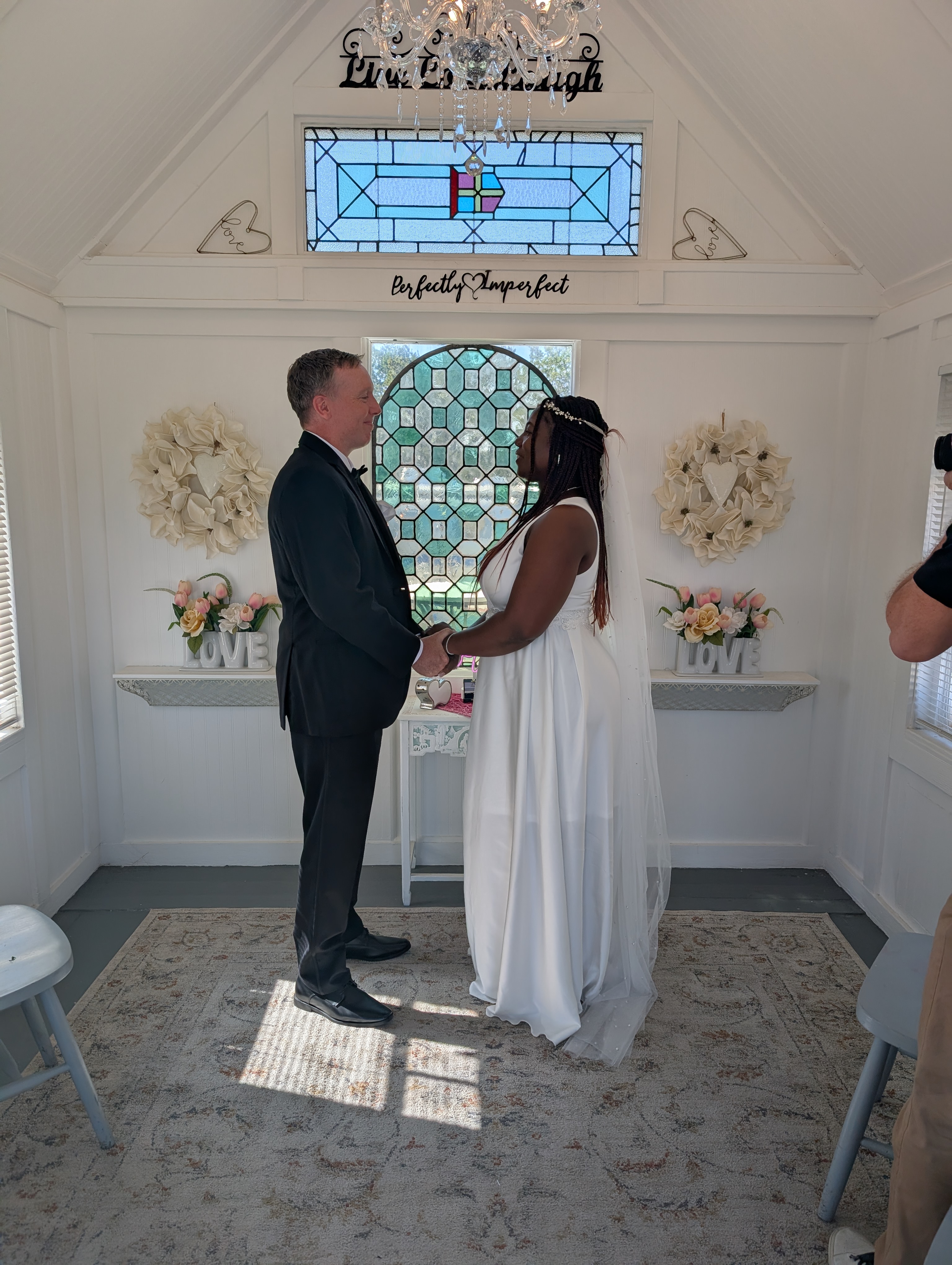 Cozy intimate chapel wedding ceremony with warm lighting