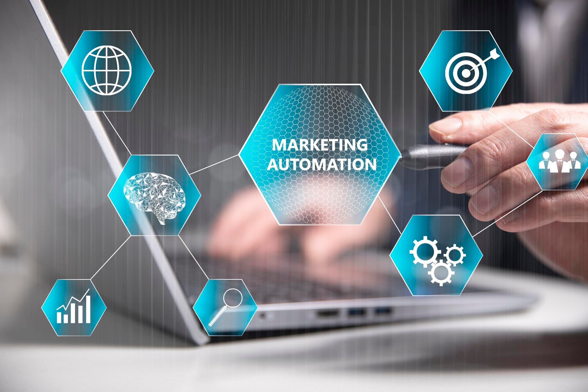 Marketing Automation Graphic overlay over someone's hands typing on a laptop