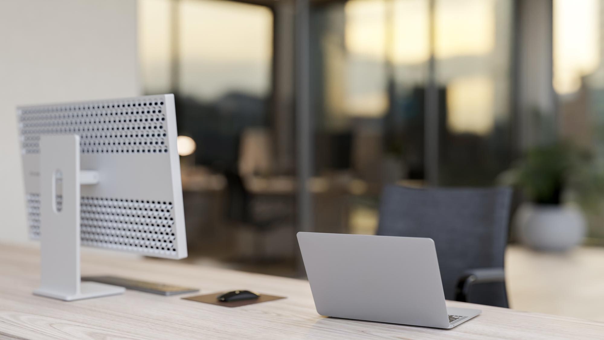 Why WordPress Web Hosting is Essential for Your Business Growth 12 a back view of an office desk in an office buildin eb537a57d670357b2806