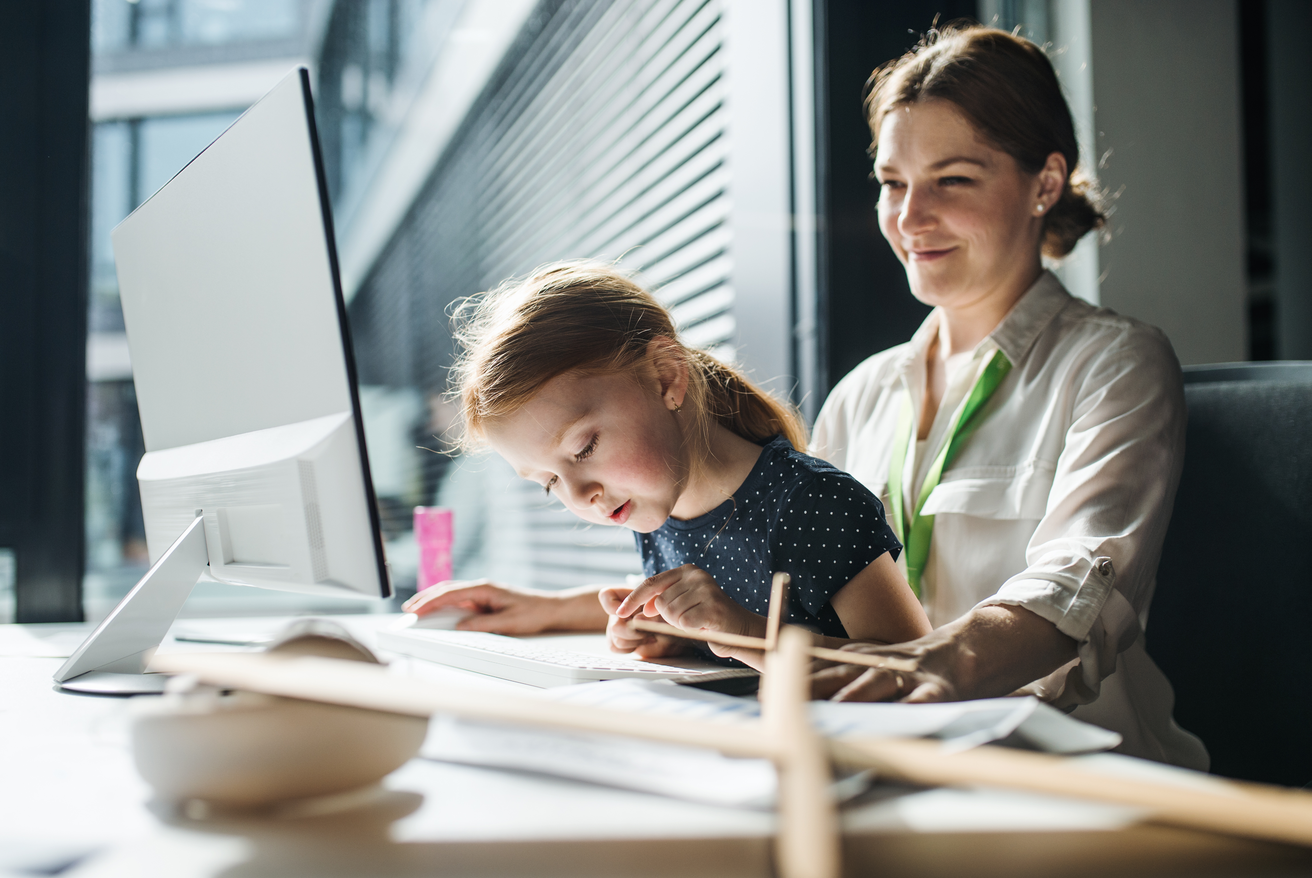 A Businesswoman With Small Daughter Sitting In An 8c2236d58d0f0f73afa3