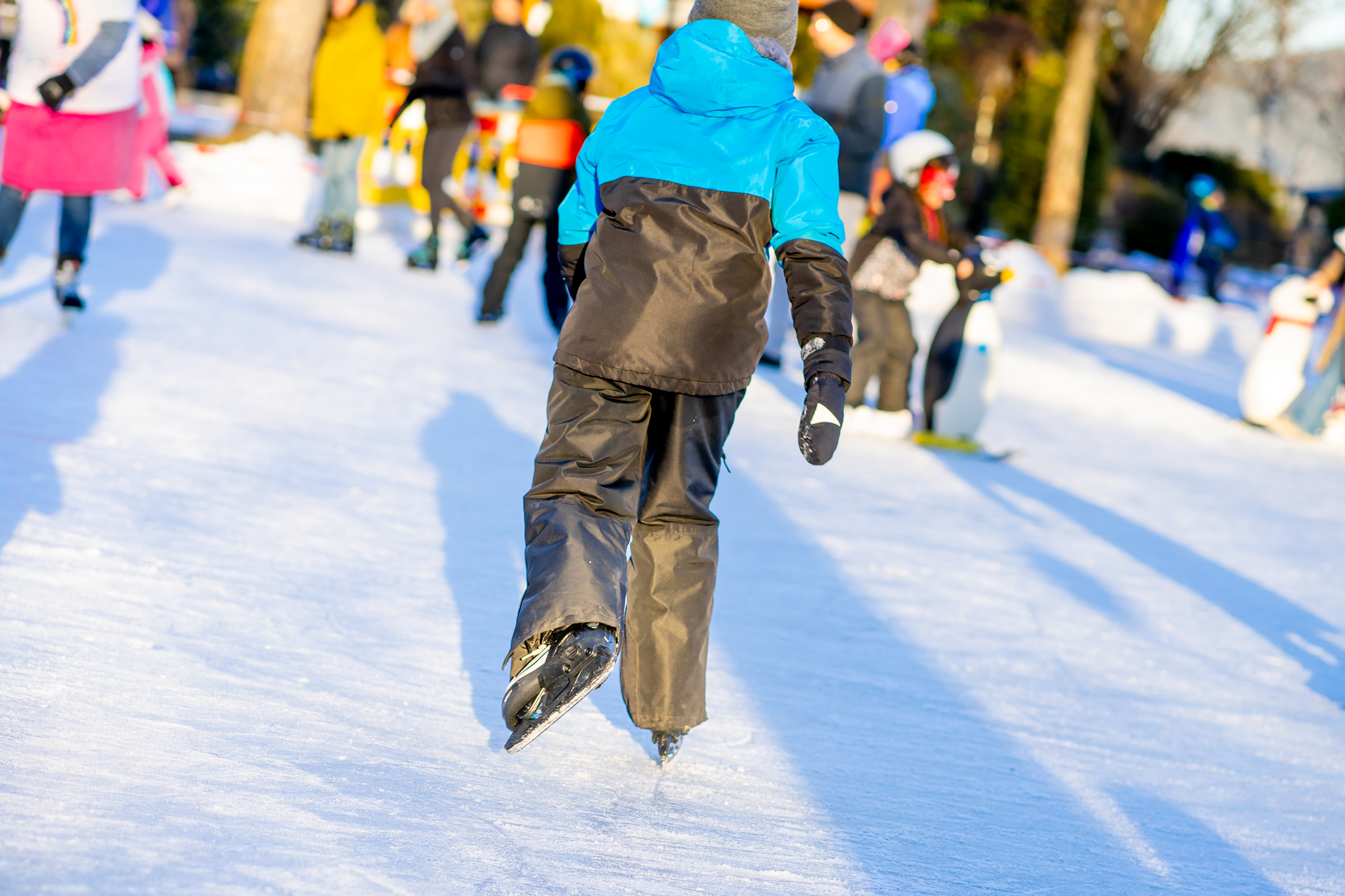 a child skates on ice in an open area in winter p d2216ba214b8500691bf