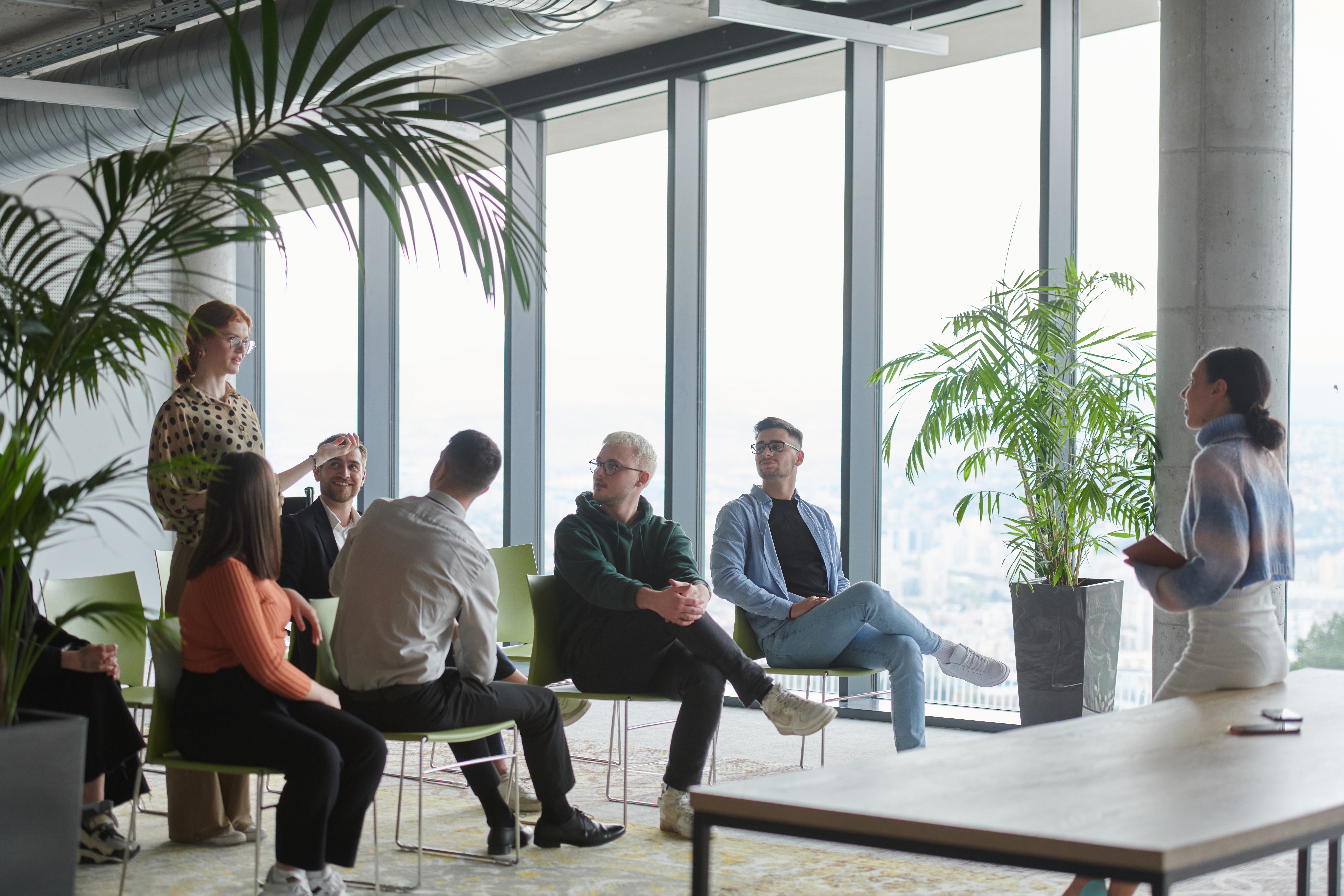 a diverse group of business professionals sits att f646cc2cc13cf80eb1aa