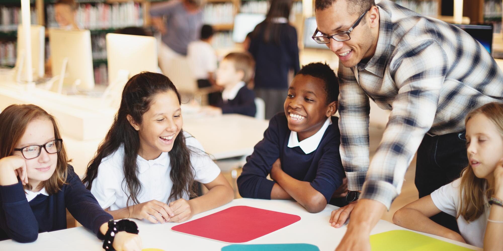 A Diverse Group Of Children And A Teacher In A Cla D5af2292bc0ffd16795a