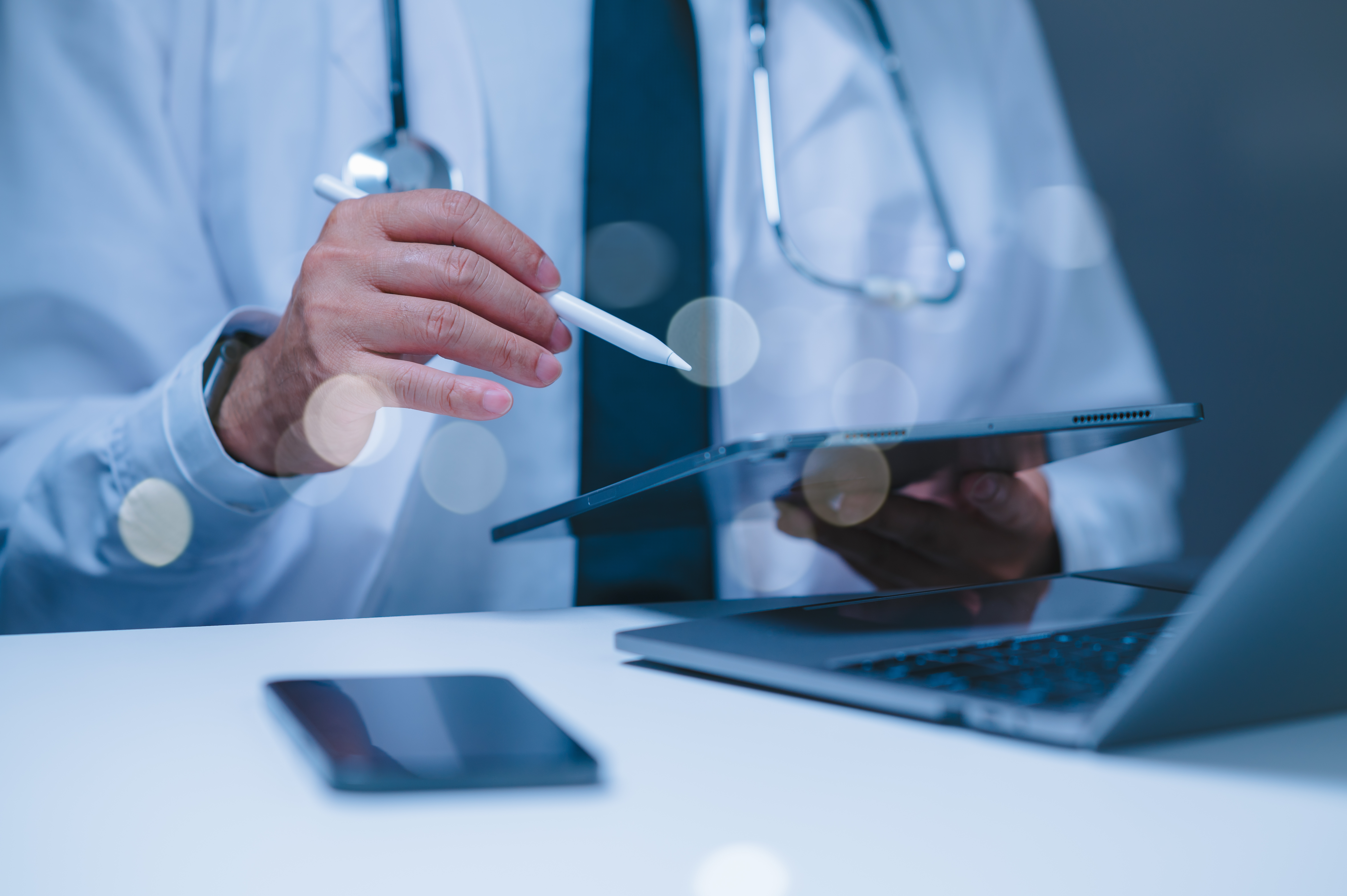 Crafting a Brand Story: Captivating Health & Wellness Clients 2 - MedWell Digital Marketing Agency a doctor is using a tablet and a pen to take notes c8021663bb7af5319872 - MedWell Digital Marketing Agency