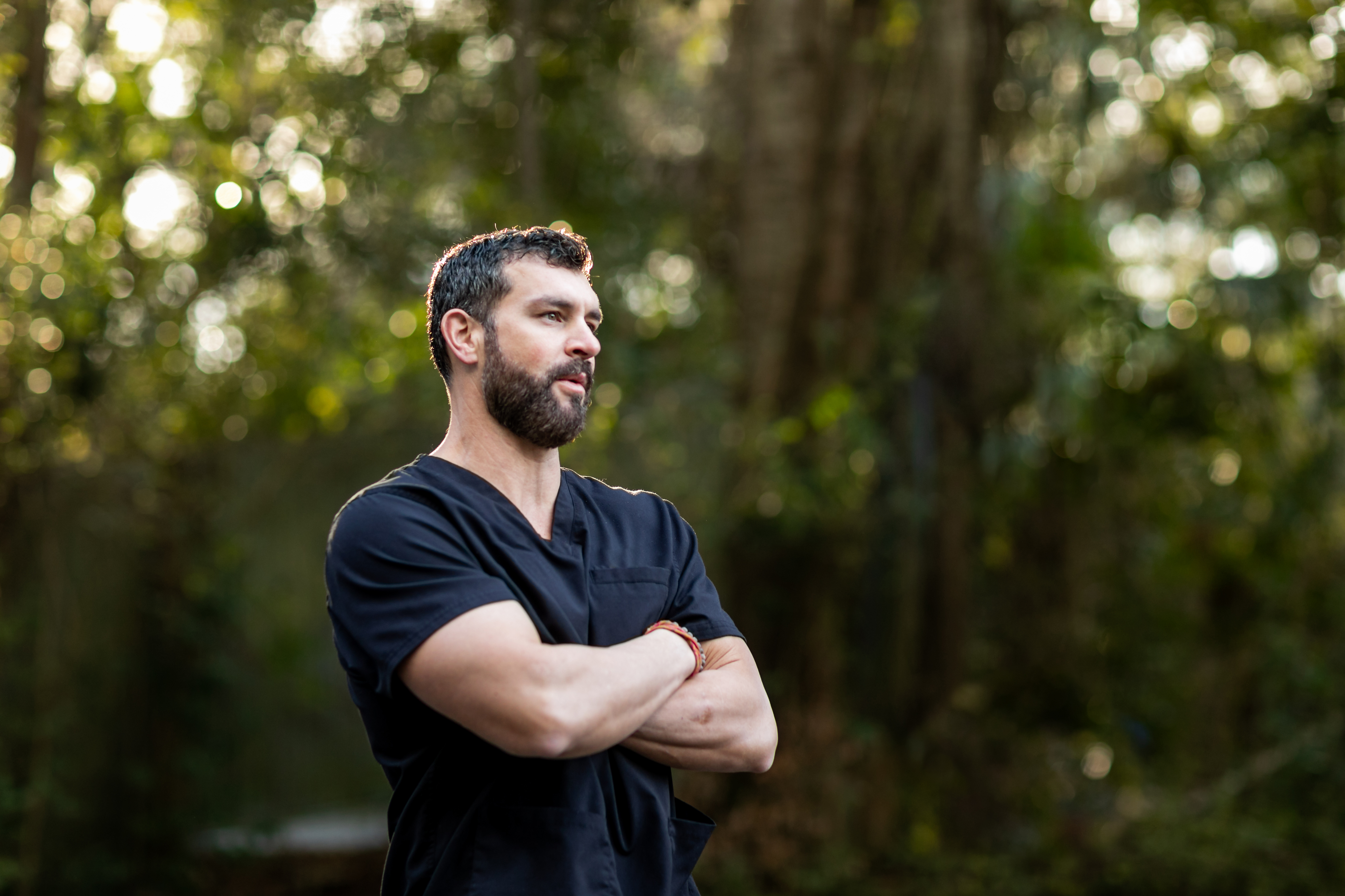 A Doctor With Dark Hair And A Beard In Black Scrub 2B29669Ea23Cb91D40B0