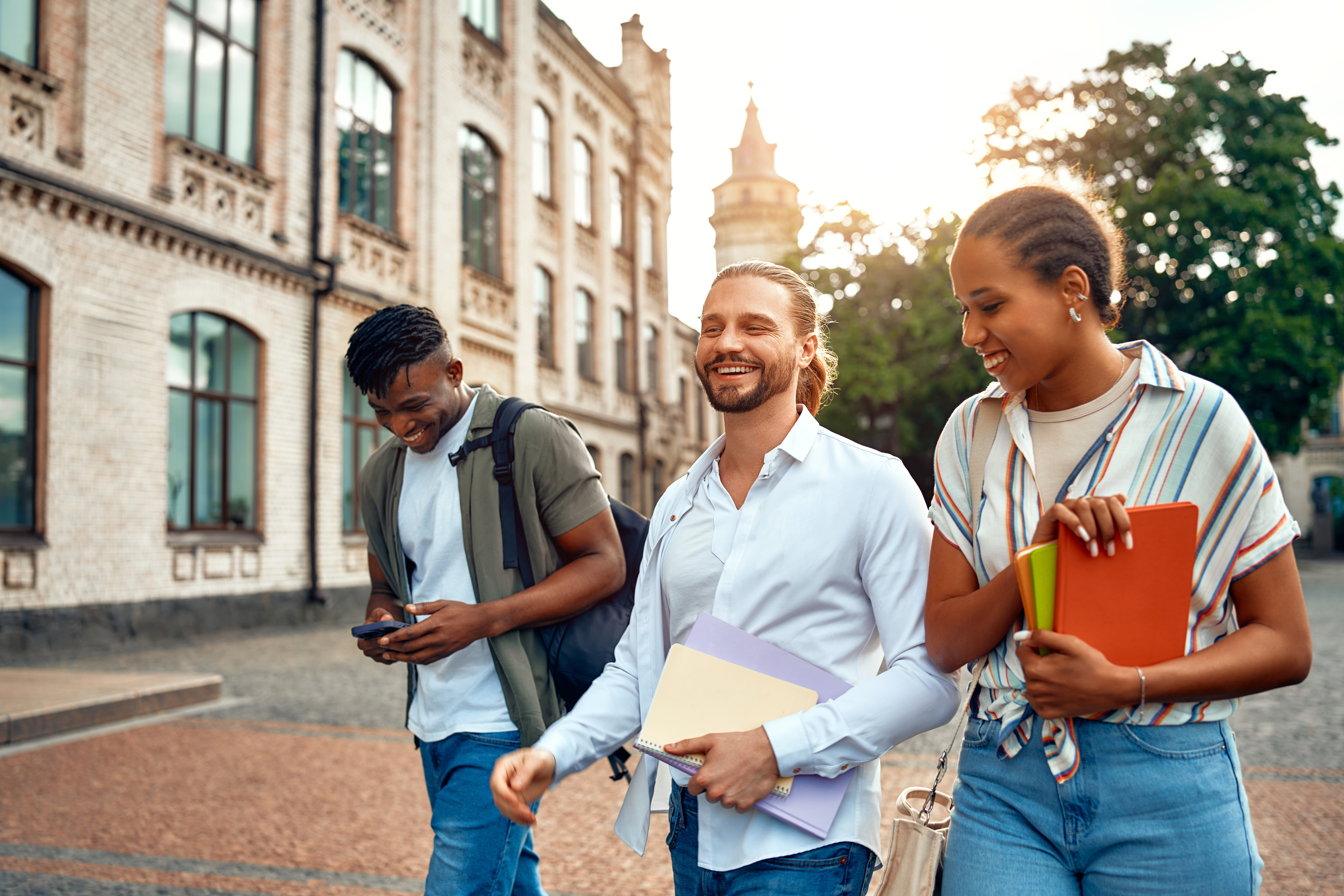 A Group Of University Students Walking And Chattin B0C08A41Acfeb179Fb89