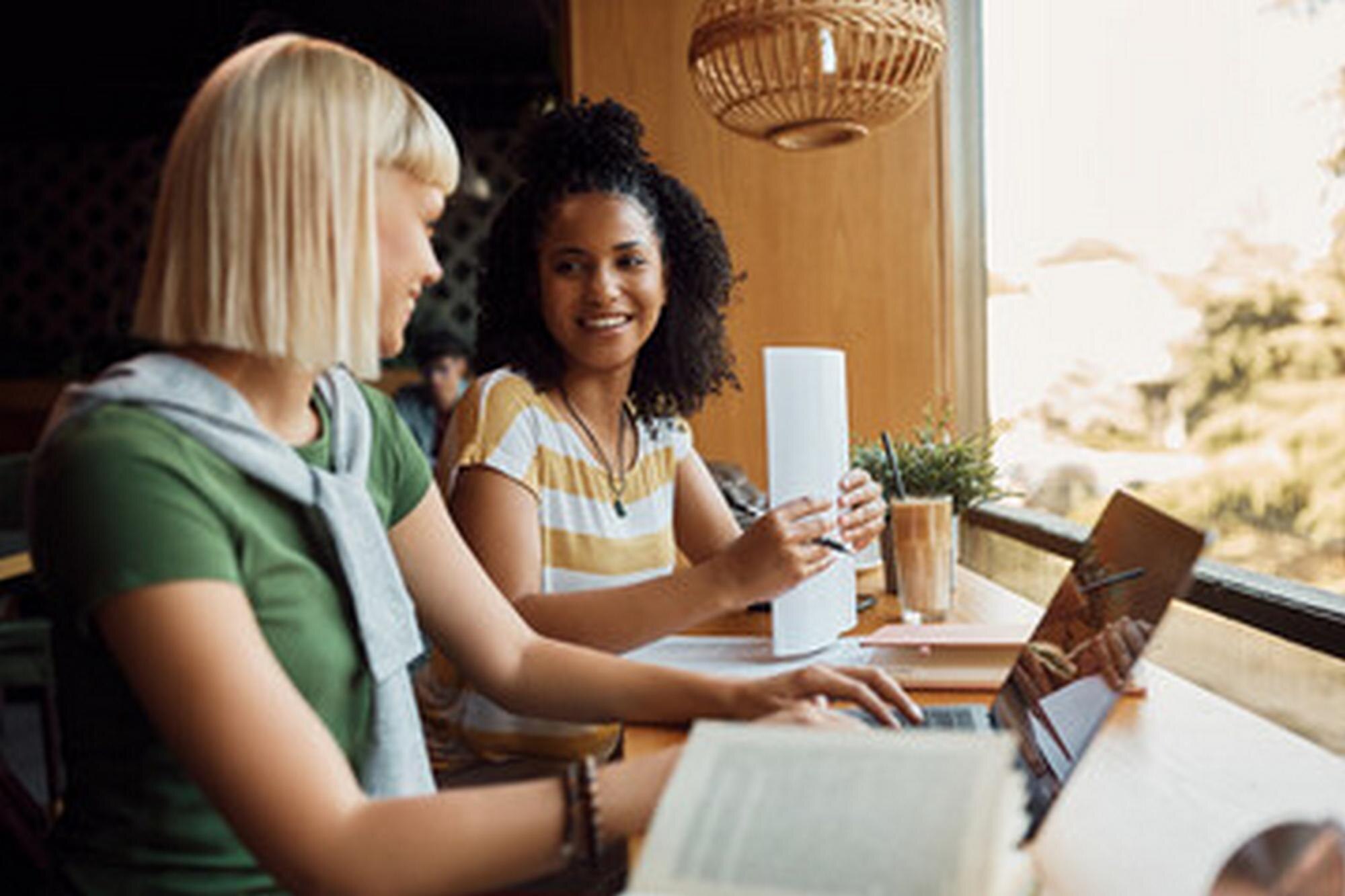 Unlock Your Wanderlust: Create Multiple Income Streams Through Travel and Network Marketing 1 a group of women sit at a table with laptops and p 20df1c93c400225e10b3