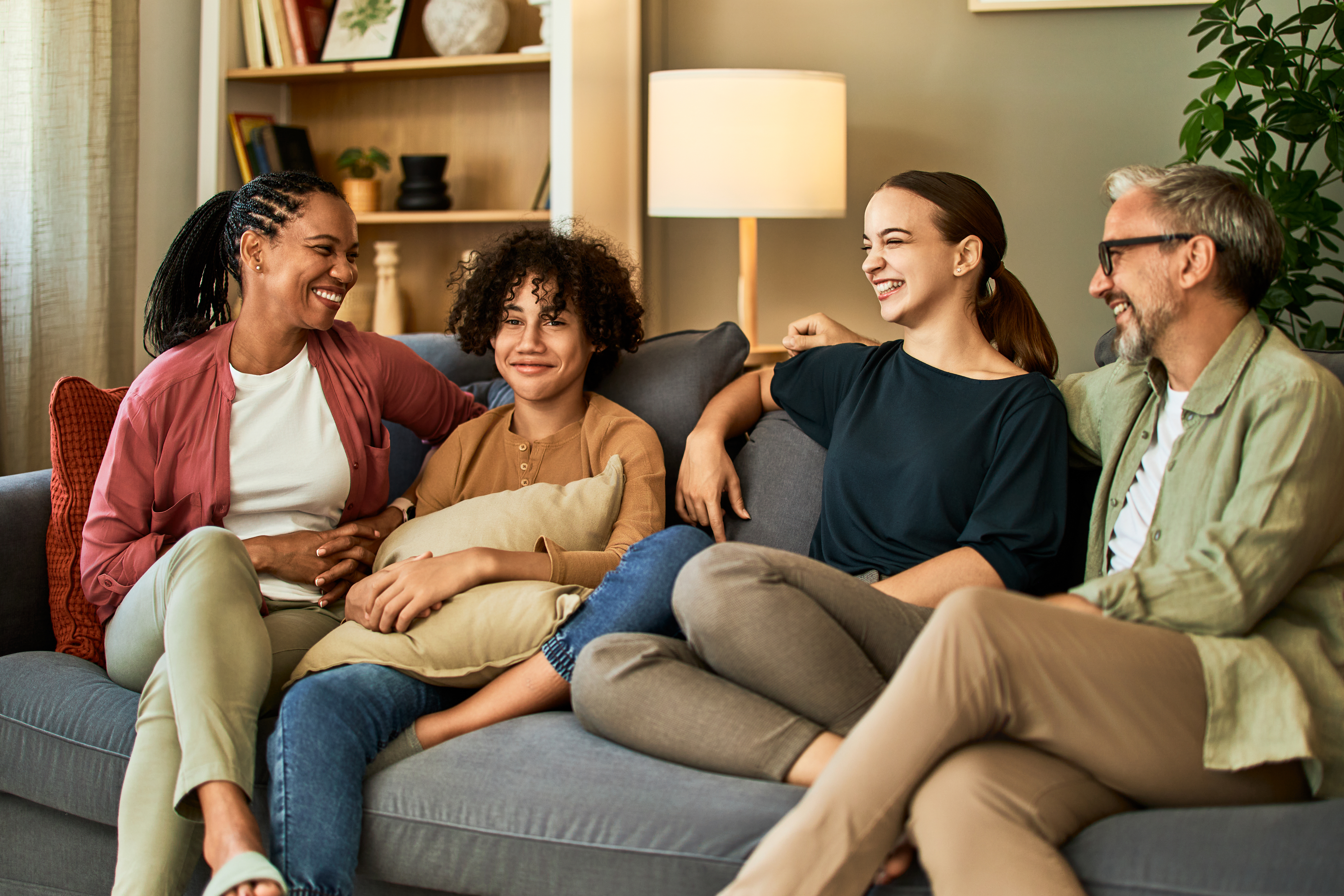 a happy family of different races and ages sitting 8faa52215f2d4aa9190b