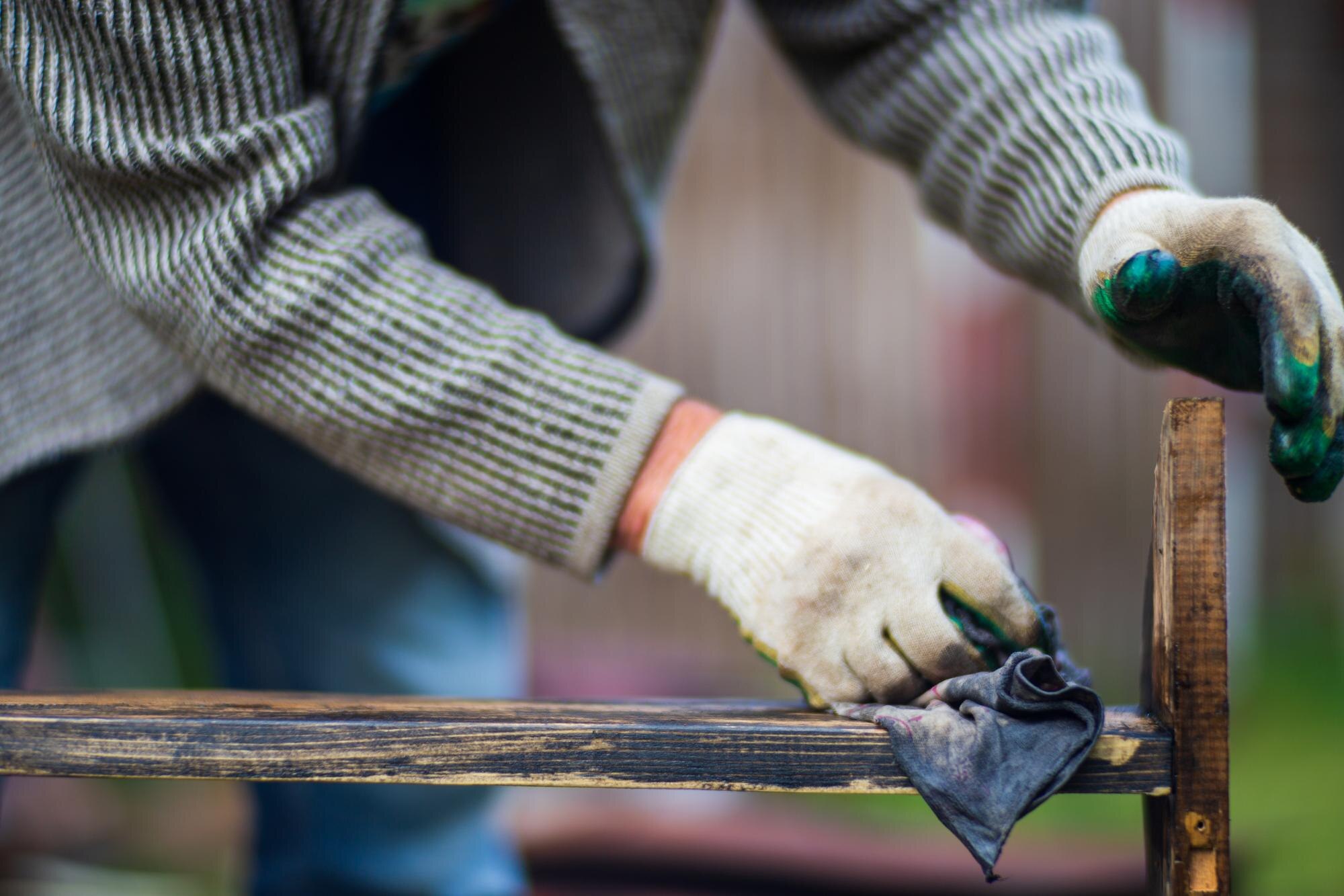 Why Plastic Fabrication Wins for Winter Home Improvements in Australia 2 a man applies paint to a wooden surface with a bru 06e880a31947e8a23665
