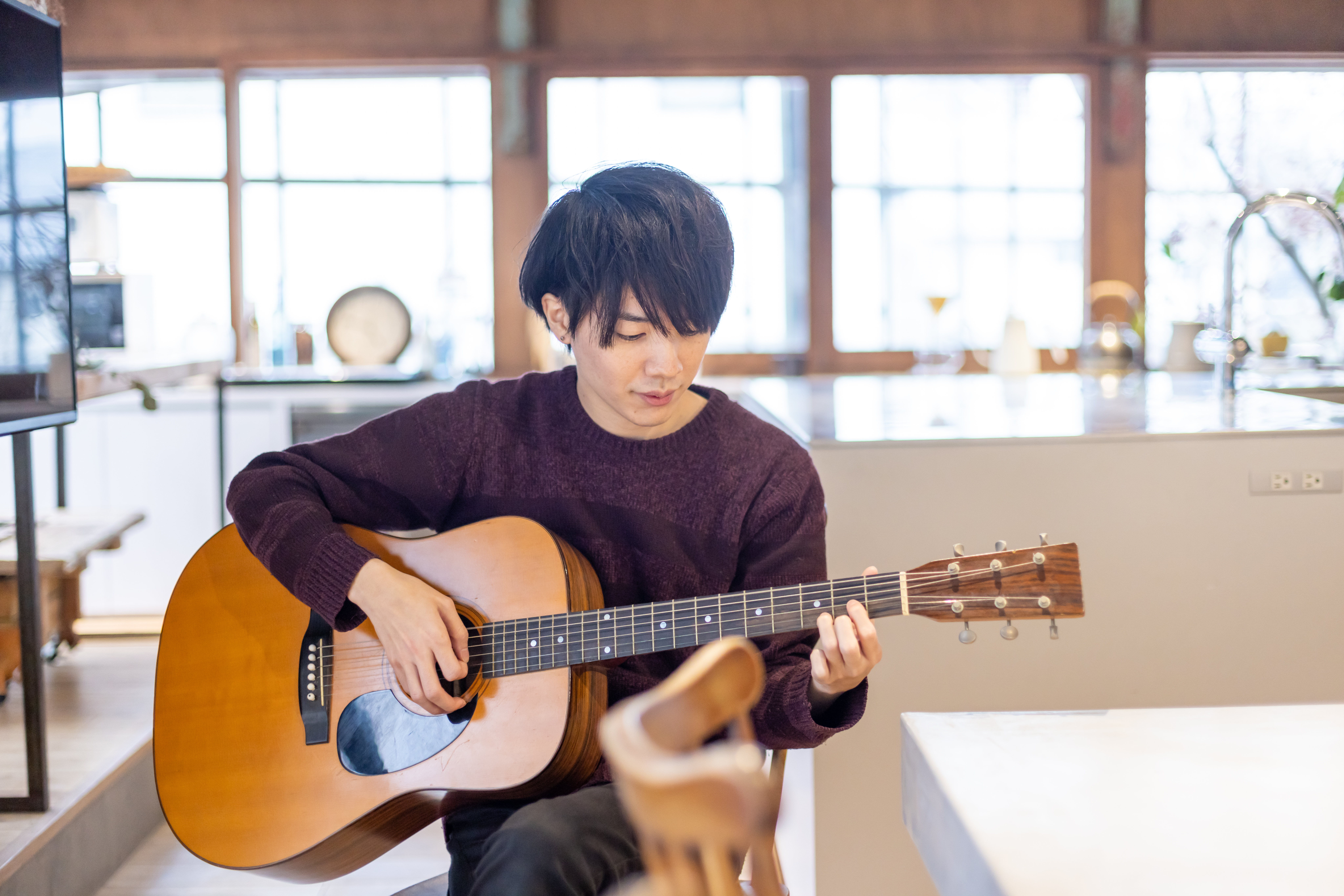 Guitarist playing at home