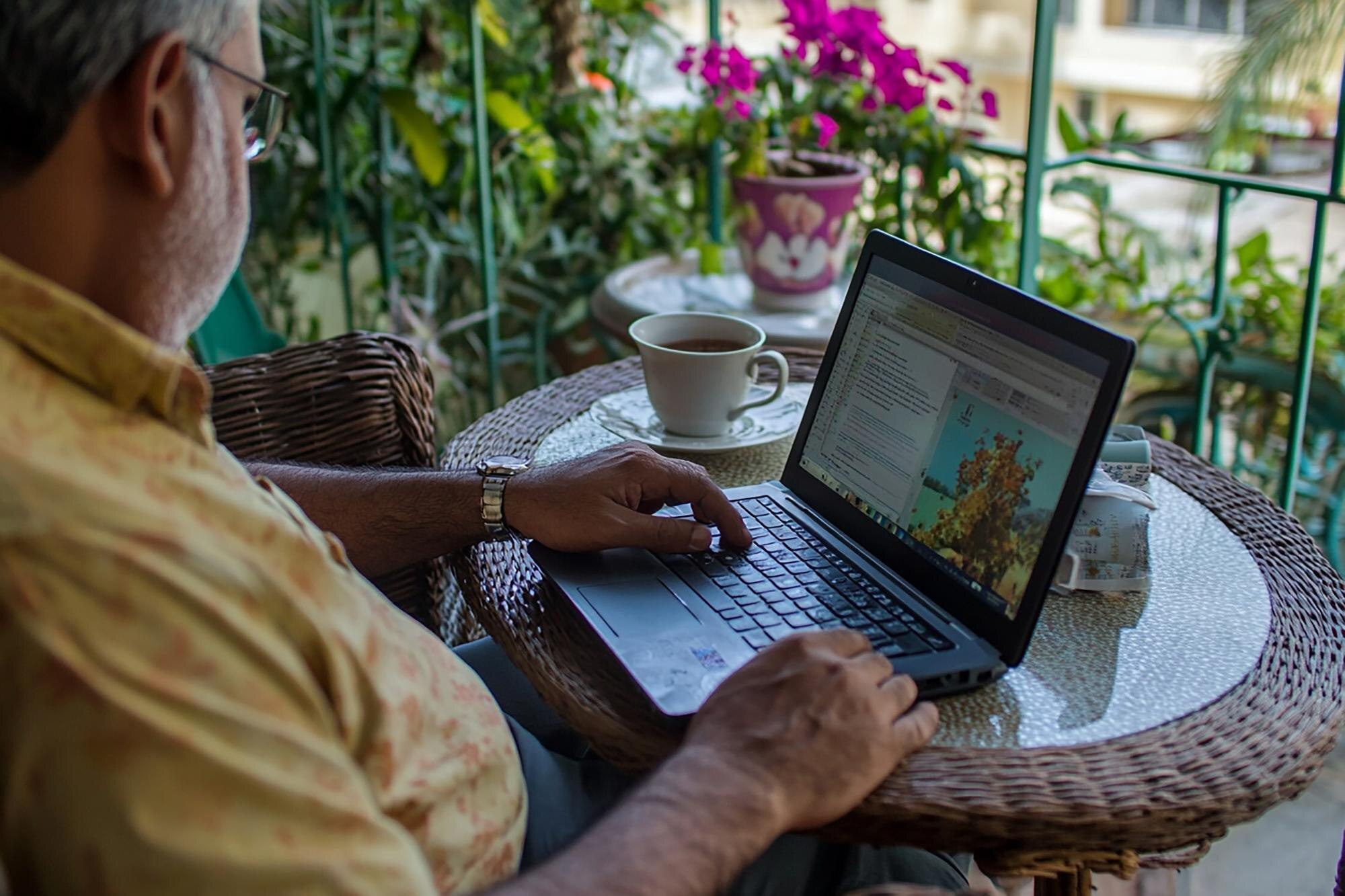 a person is using a laptop with a keyboard and a p 926c794c43462ef7e195