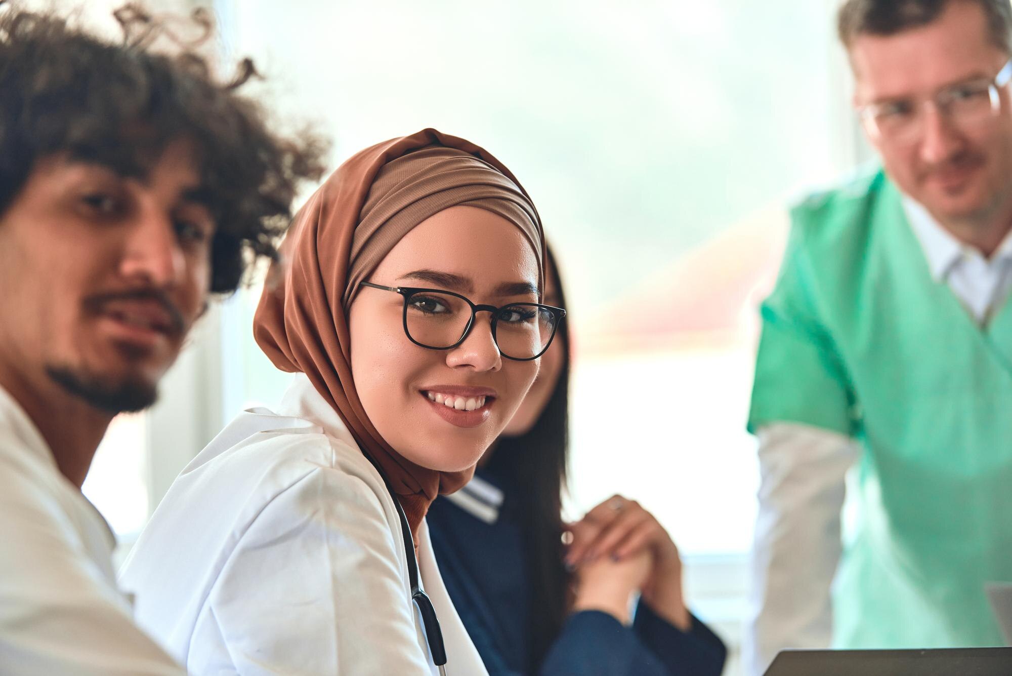A Smiling Female Doctor In A Hijab Participates In E557d15485109037dede