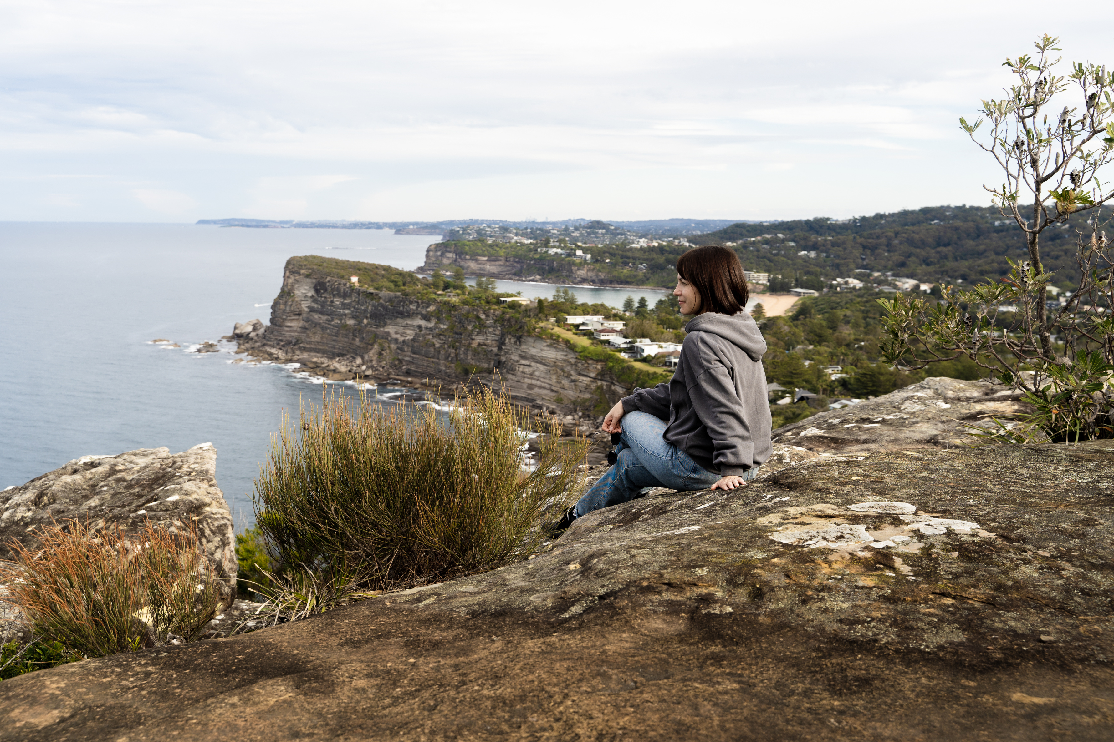 Sleep Well, Explore Further: The Benefits of Handpicked Stays on Your Self‑Drive Tour 5 a woman enjoy a view from bangalley head nsw aus dbe8db9d7064d6b0db9c BTOURS