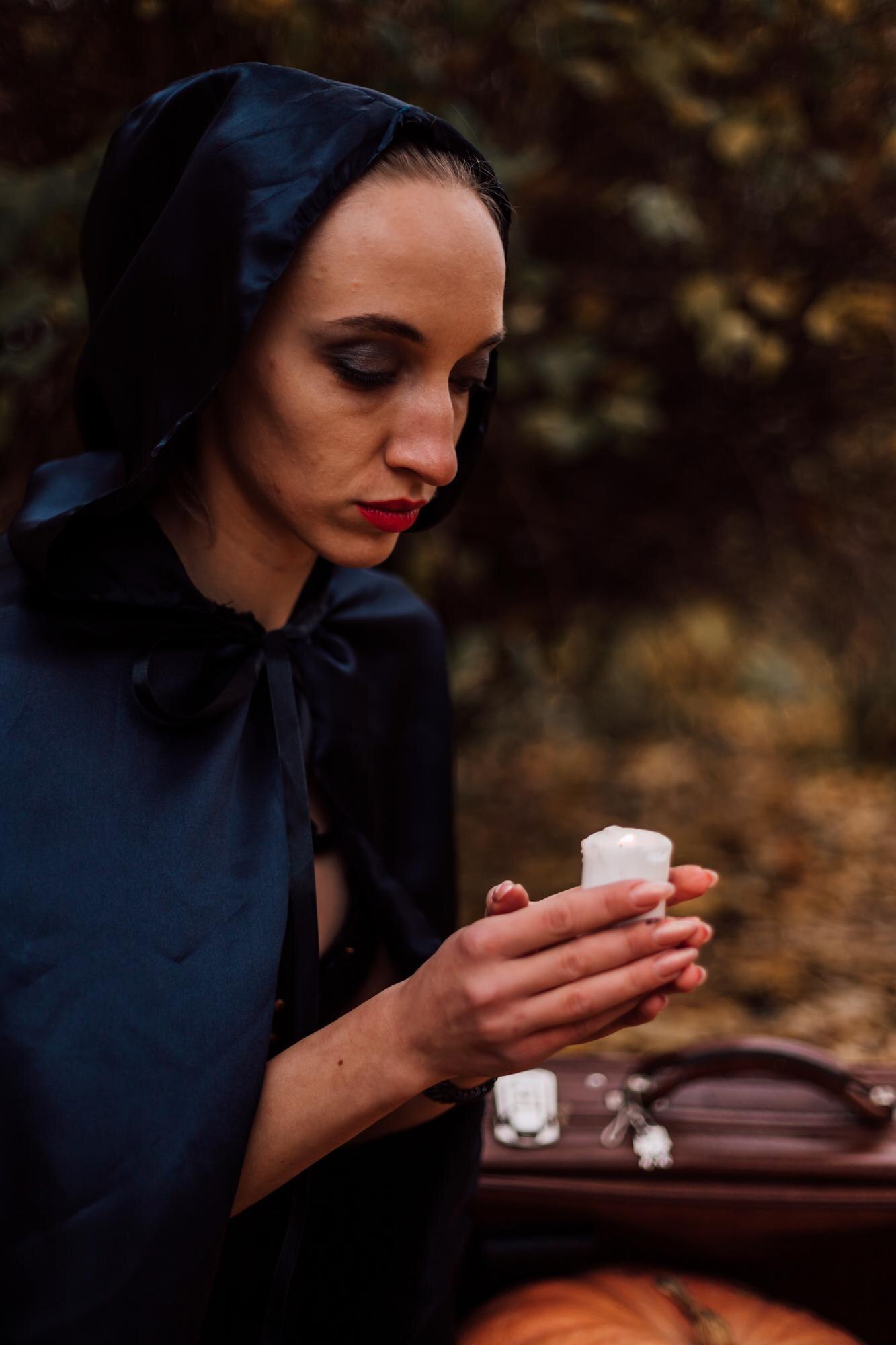 a young witch in the forest makes a spell magic in fc2f026324950f4e618c