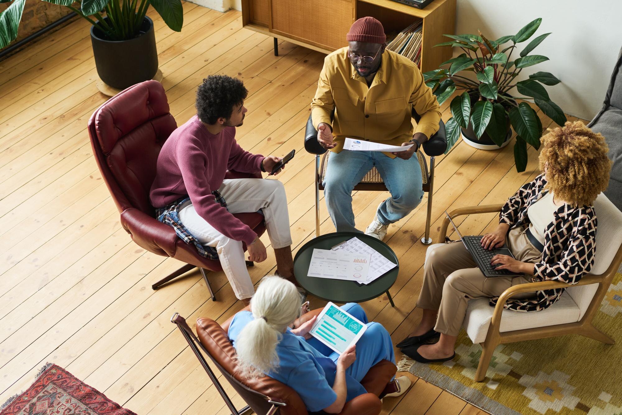 above angle of intercultural coworkers gathered in e4fd76b9d7beb535b078