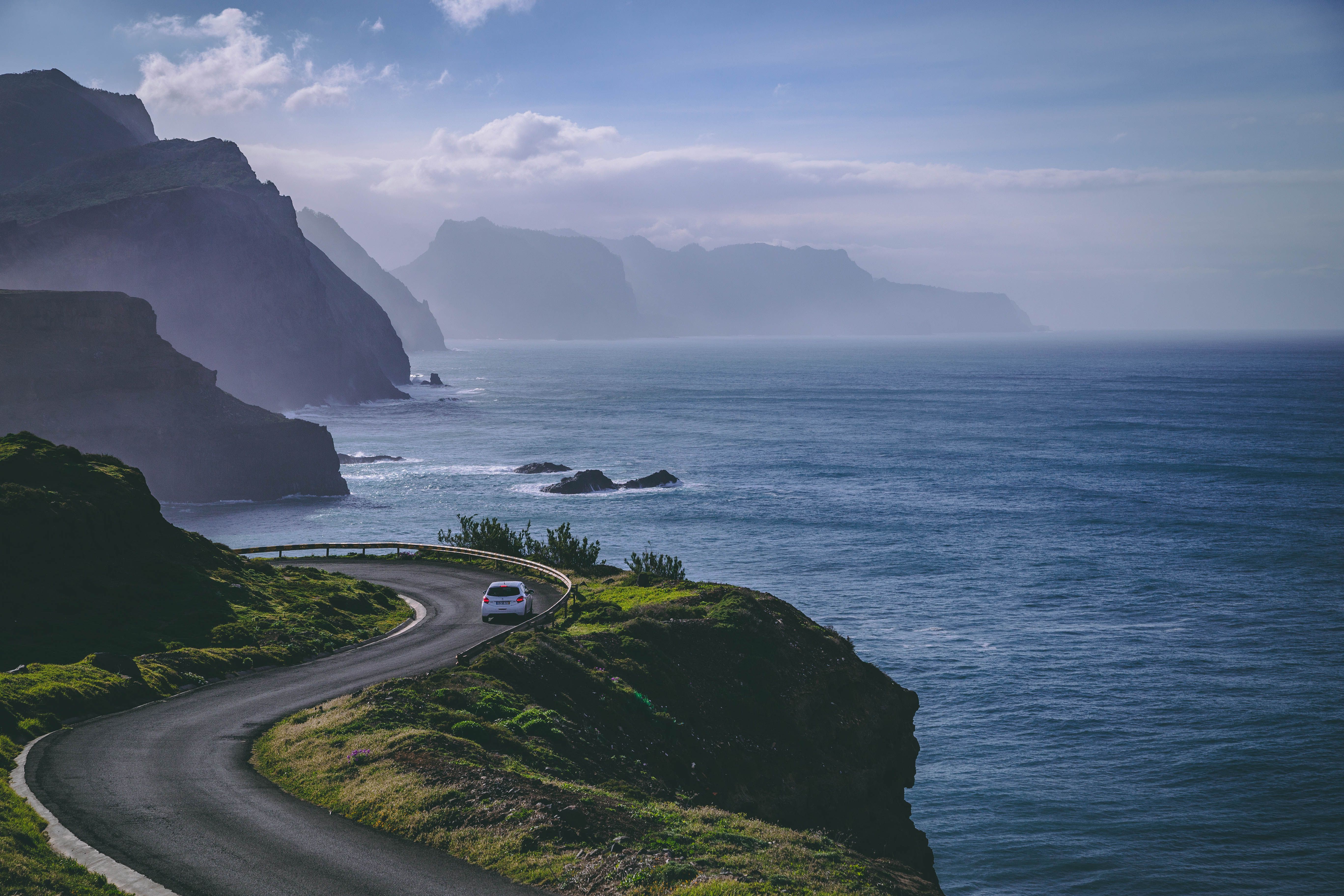 aerial view of a car on a road near the cliff in c 61b6cabfaf87f4f26f27 BTOURS