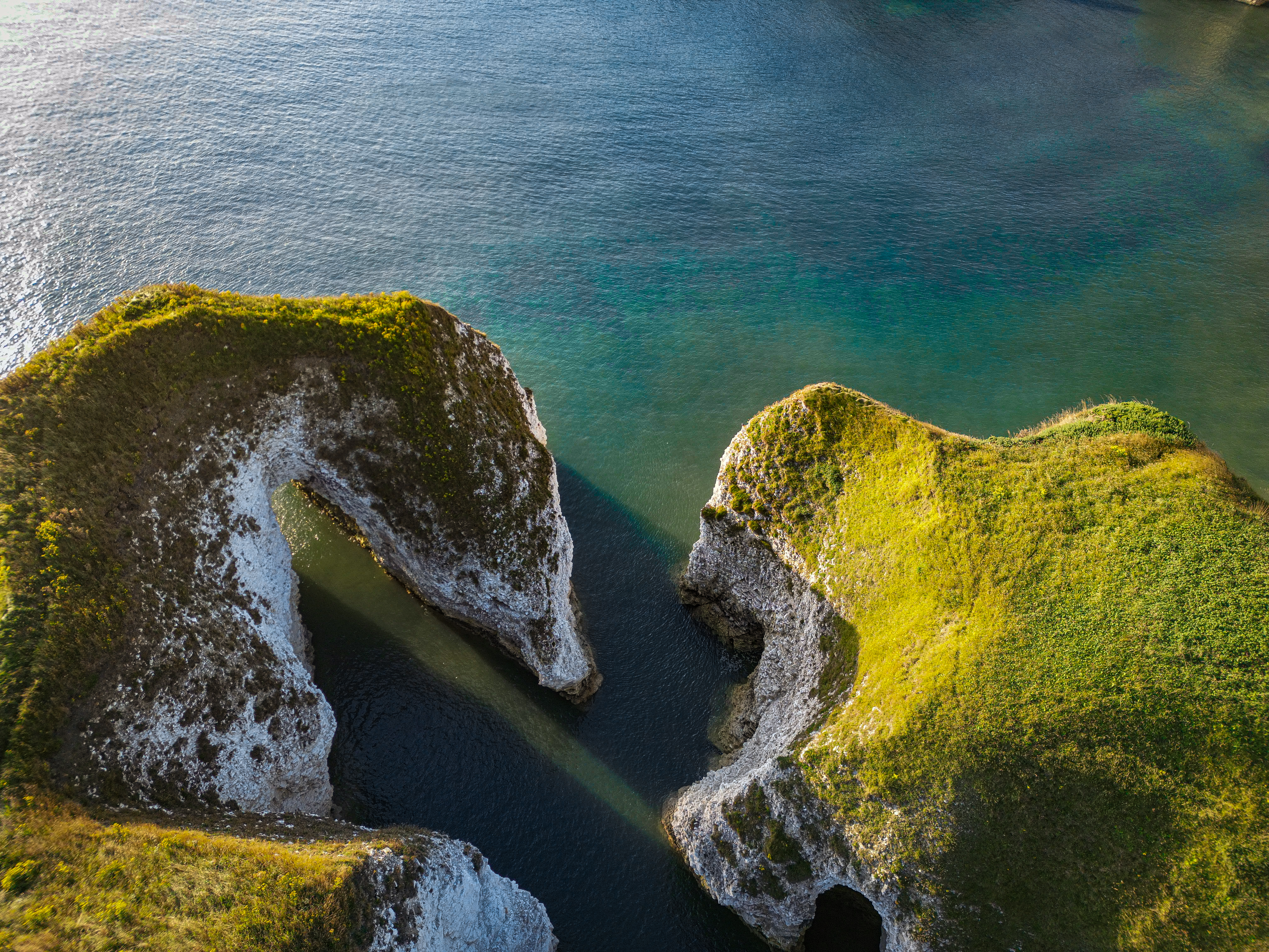 aerial view of coastal rock arch and clifftops 3a05ab9381fa9ddb516c BTOURS