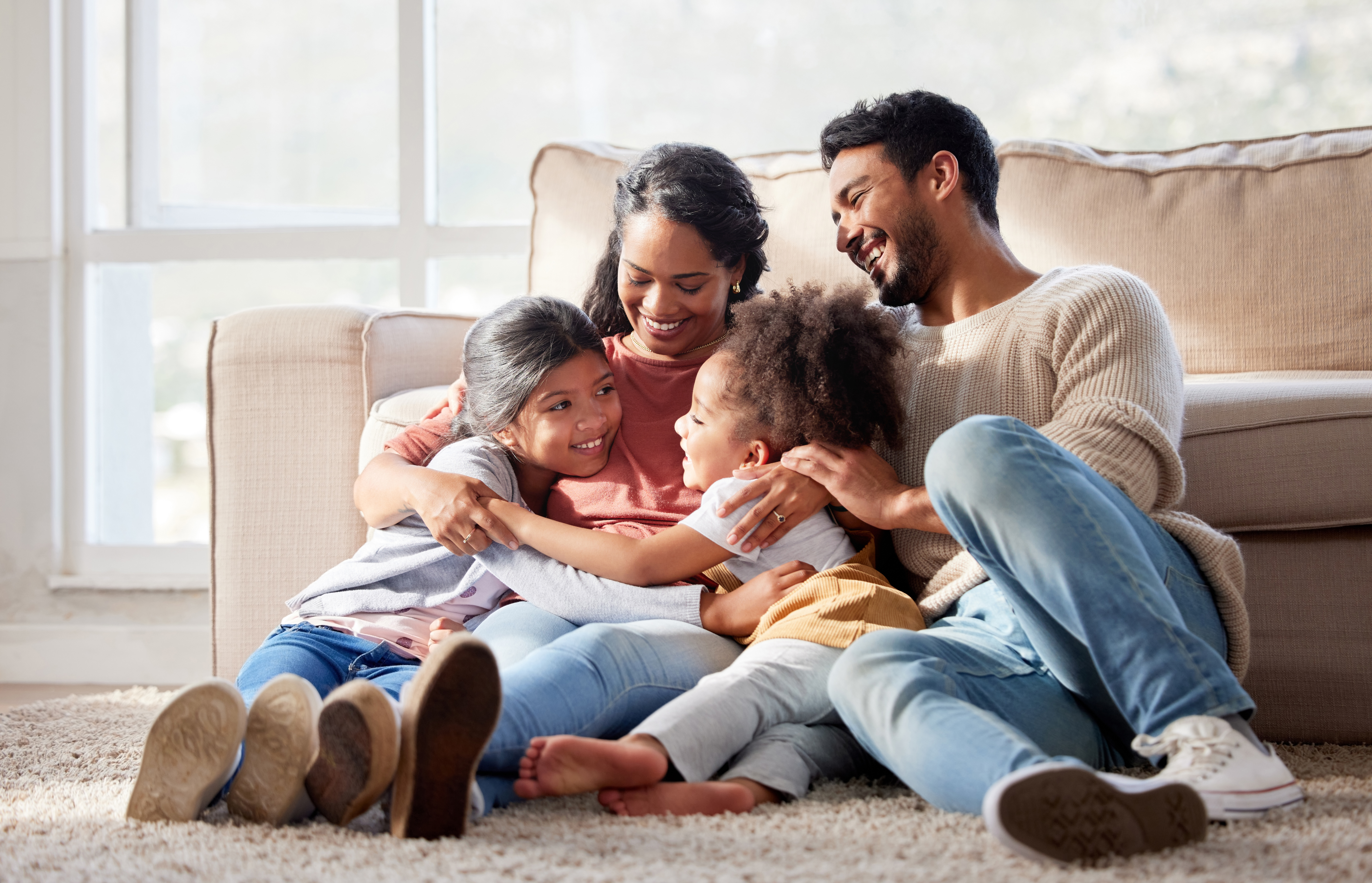 affectionate and loving mixed race family sitting 601f48fc8e7015ec1ac9