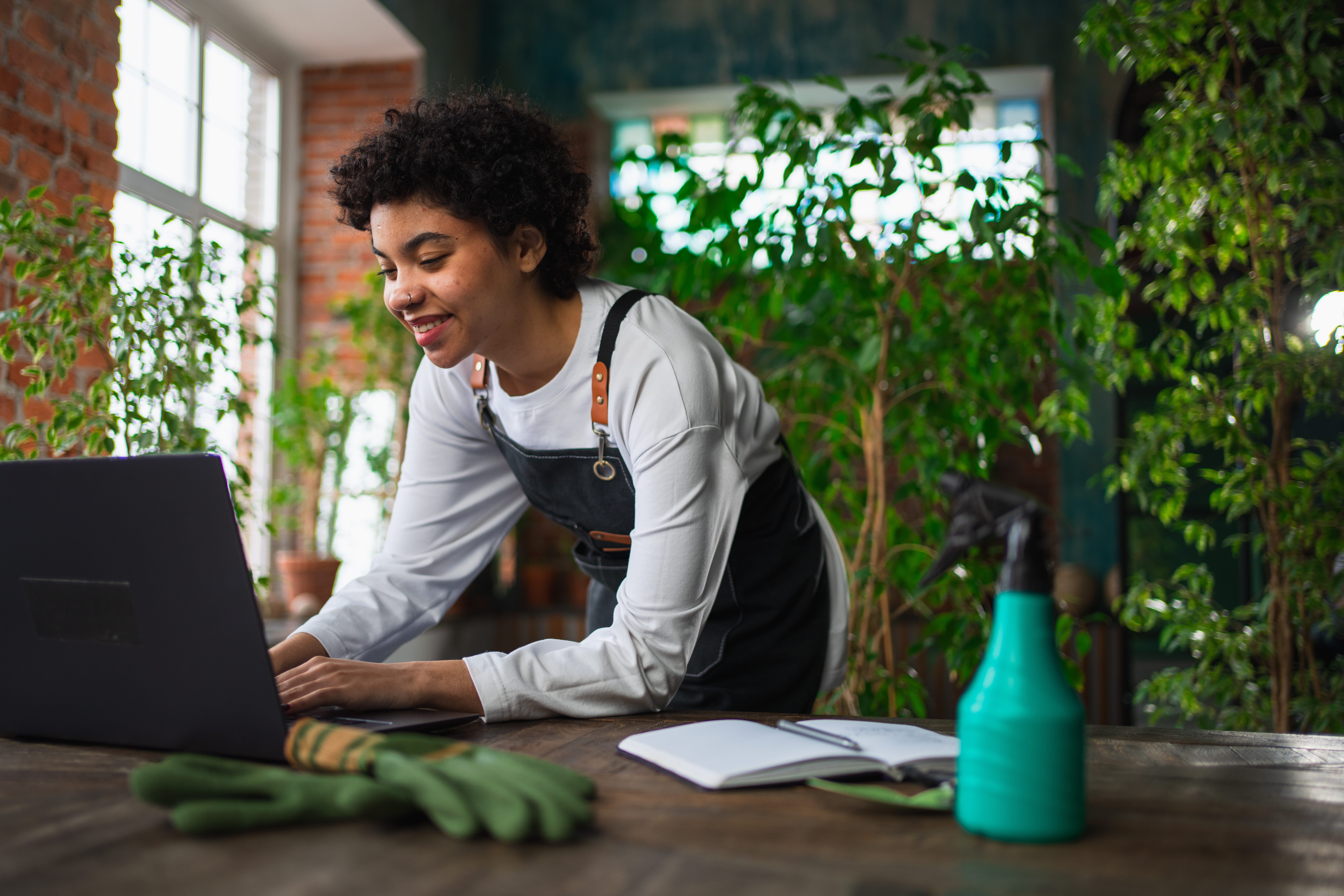 african woman florist gardener working in botanica 435cf039ebac05820da0