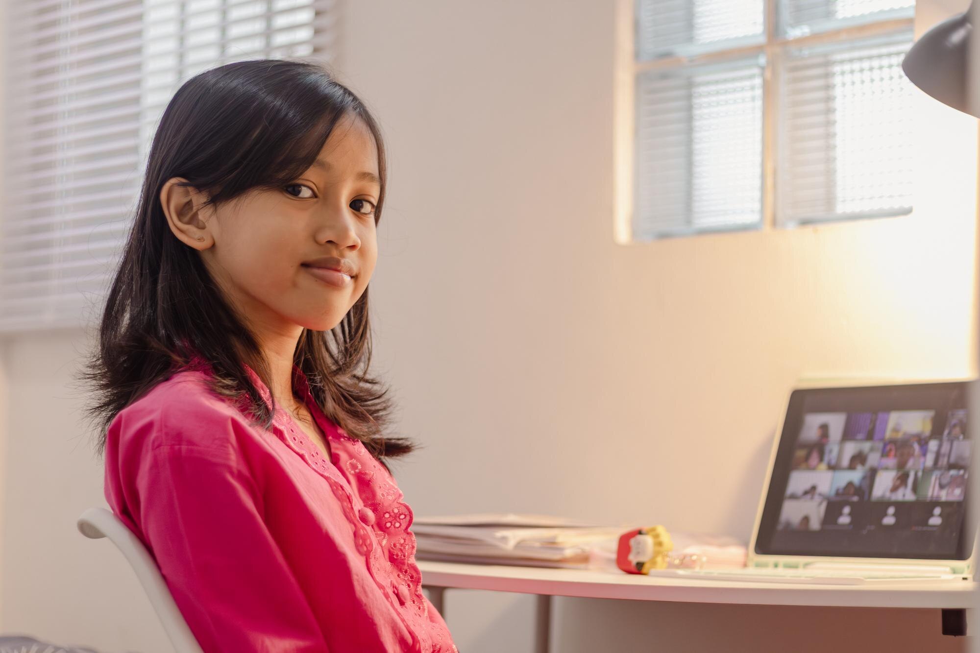 An Indonesian Female Student Studying Online From 2a777e80f43bab20f3df