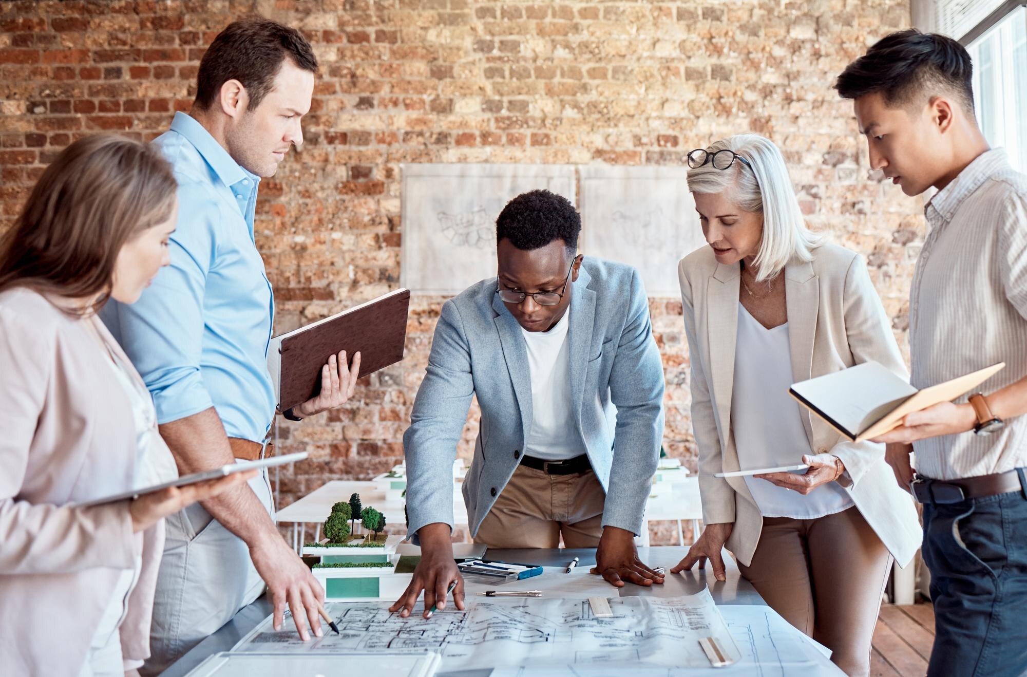 architecture blueprint and business people in meet 5cdb42dfe58127e76efa