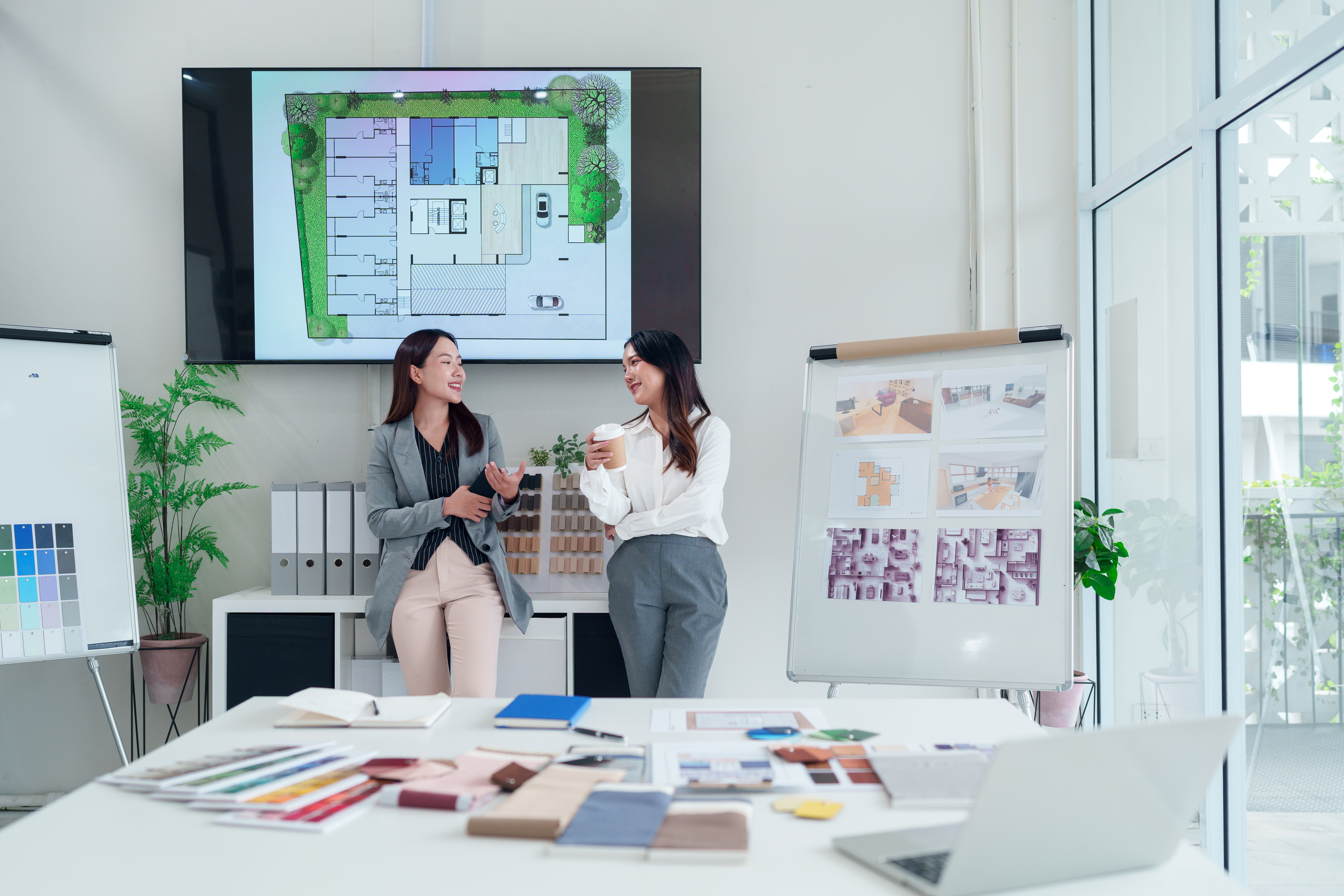 asian interior designers discussing house plans wi 6789a33adcdac2aef686