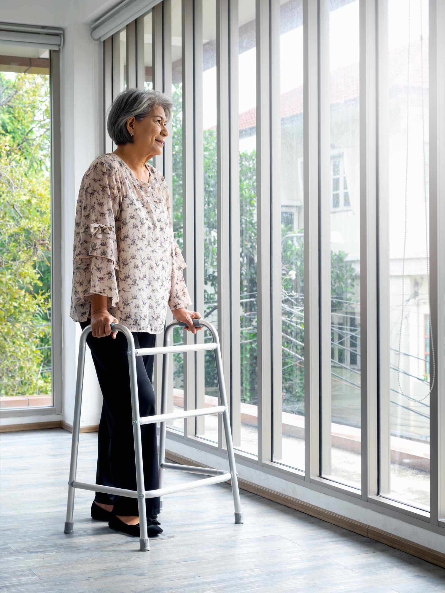 asian senior woman white hair standing with walkin f7b2f04422f6fee9acef