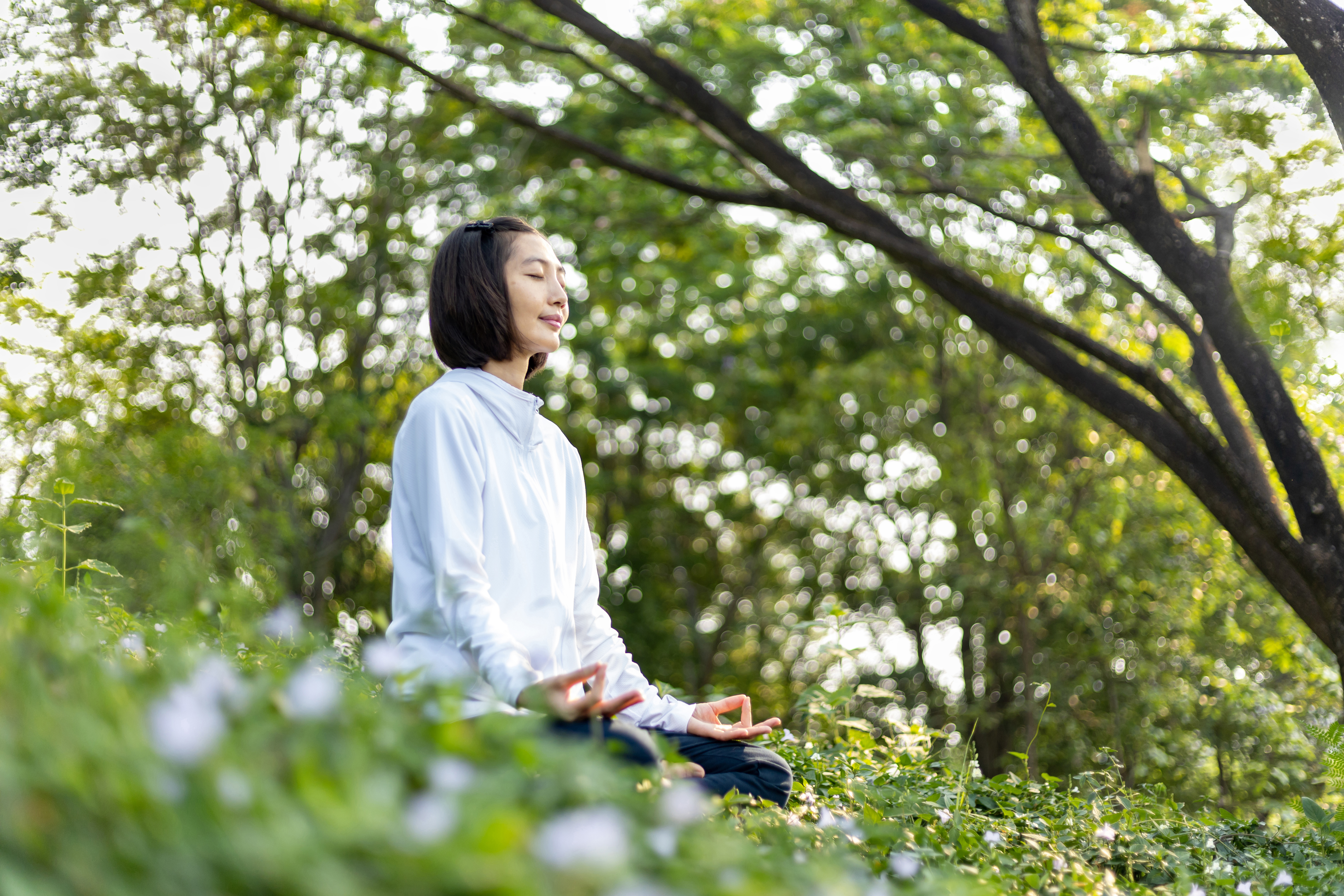 Featured image: Asian woman is relaxingly practicing meditation yo-2a8ac0025e8727adc65a