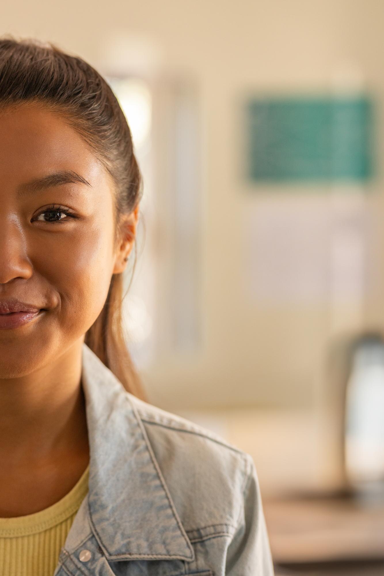Asian Woman Studying In Classroom At Desk Wearing 75034f619fa395946d90