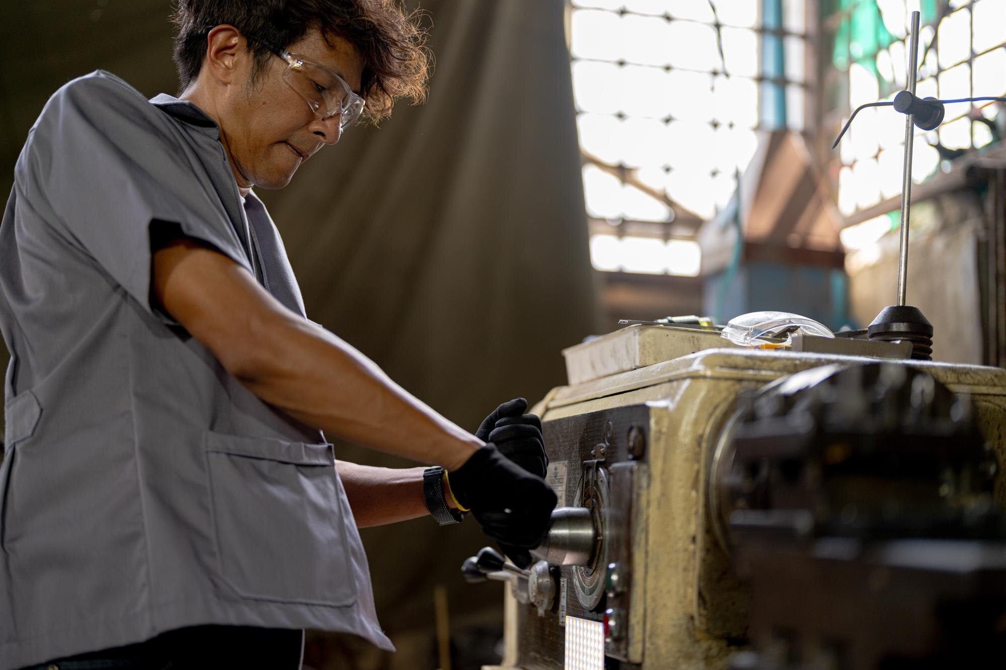 The Benefits of Choosing Local Plastic Fabrication in Australia 3 asian worker in production plant drilling at machi 89819039615dda304b0c