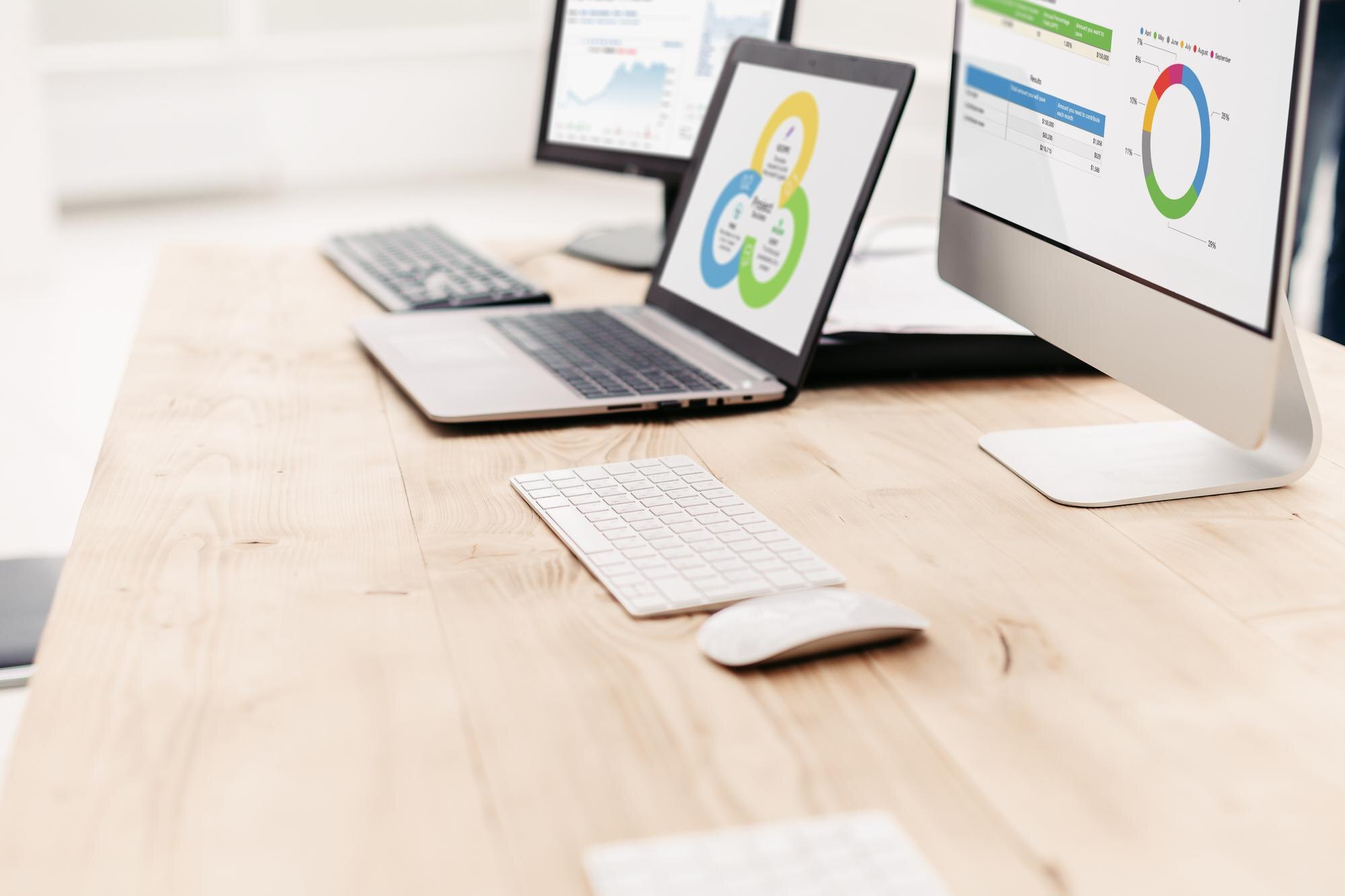 background image of computer and laptop on office af8c4026afd787562f4e