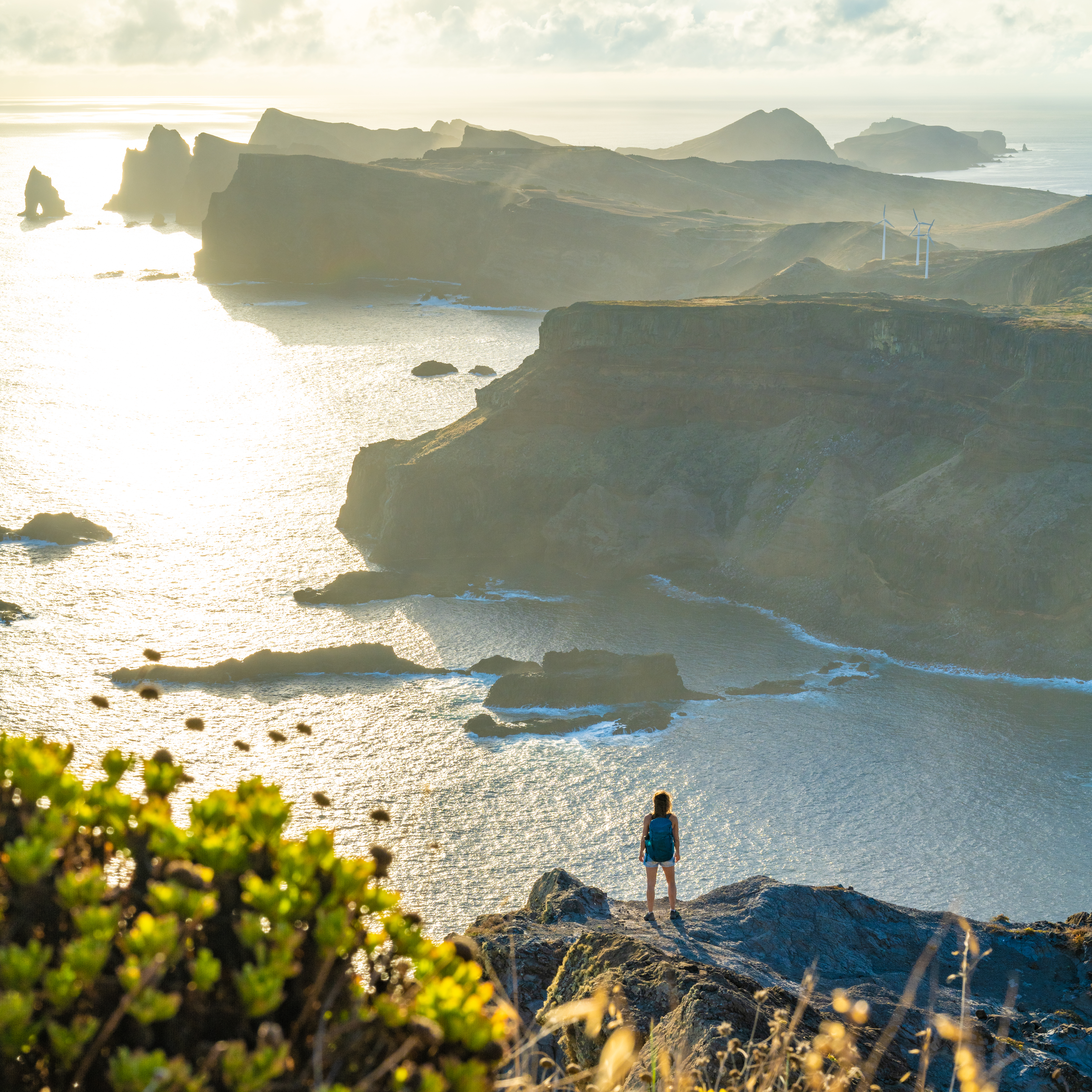backpacker woman enjoys panoramic view from a stee 6f192b46805ef7d4a4a2 BTOURS