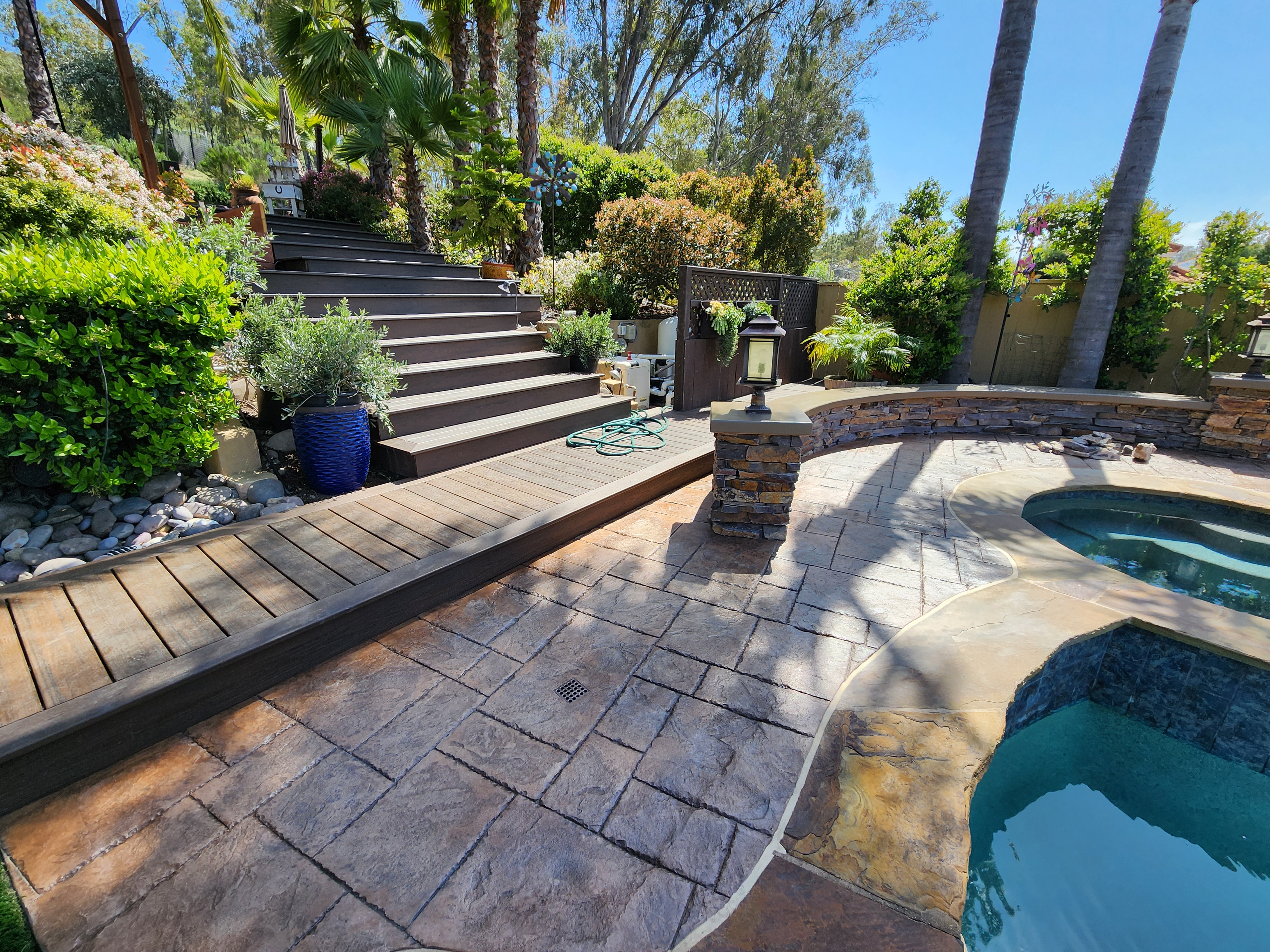 alt="concrete overlay patio servcies by calcleanseal"