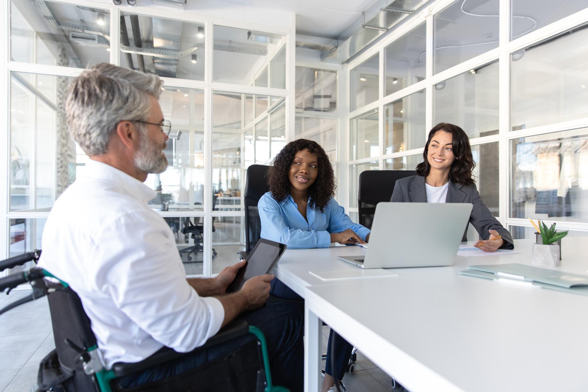 Bearded Businessman In Wheelchair Leading Group Of 63E373448Fdb5B8B8Cd3