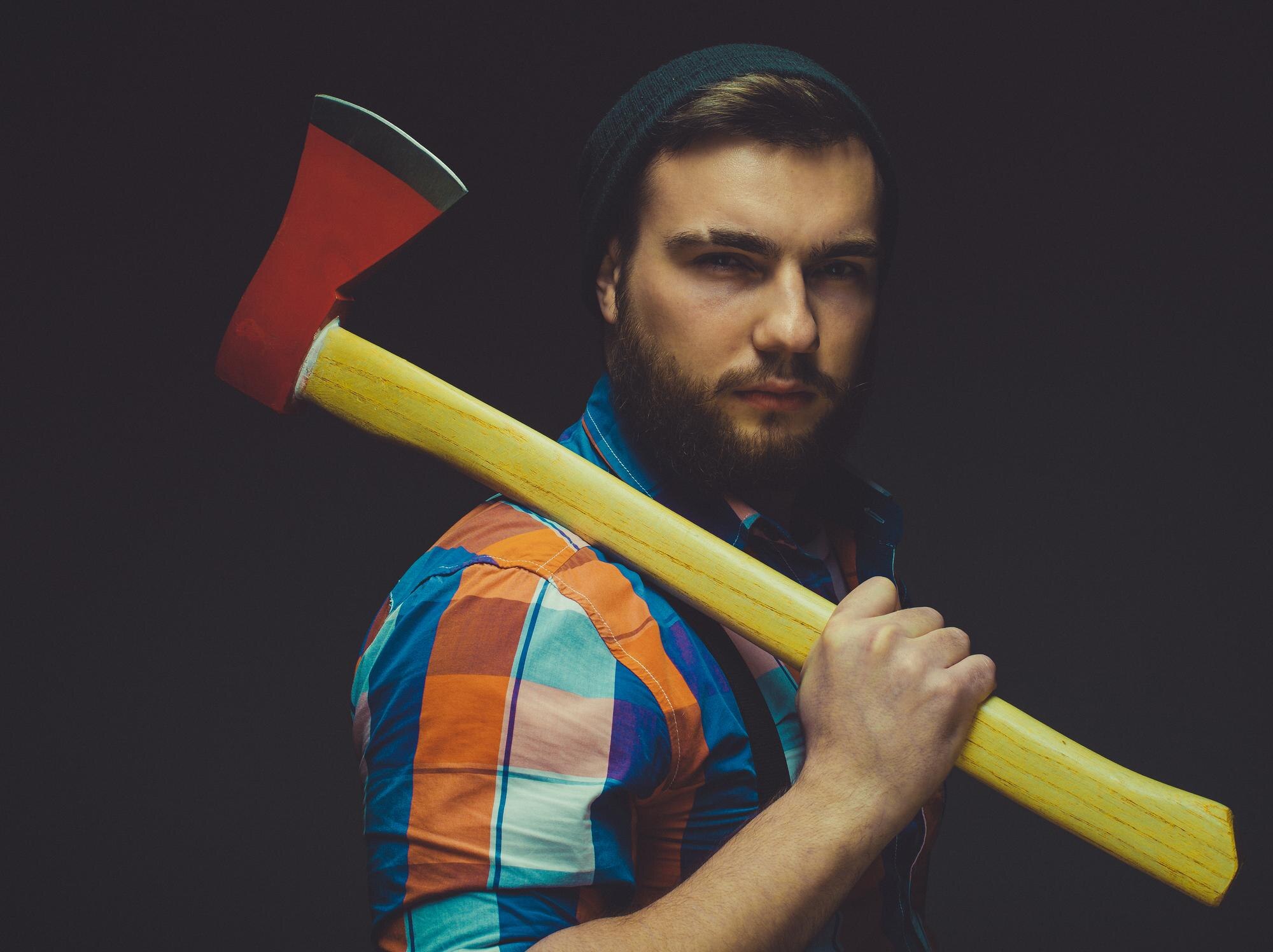 bearded man with axe posing over black background 520df9857e3398b374f7