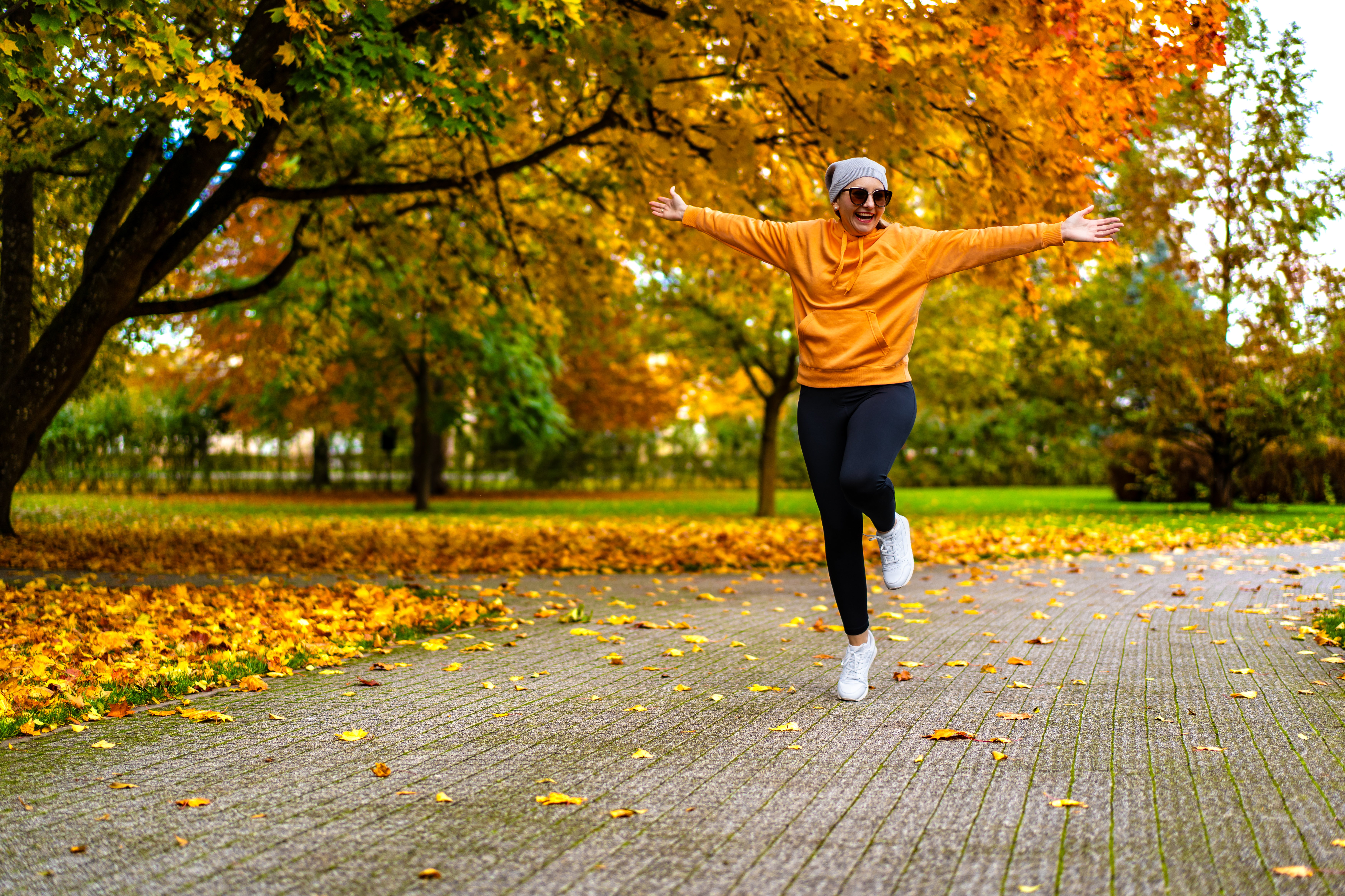 beautiful mid adult woman walking in city park f4821070175e79497753