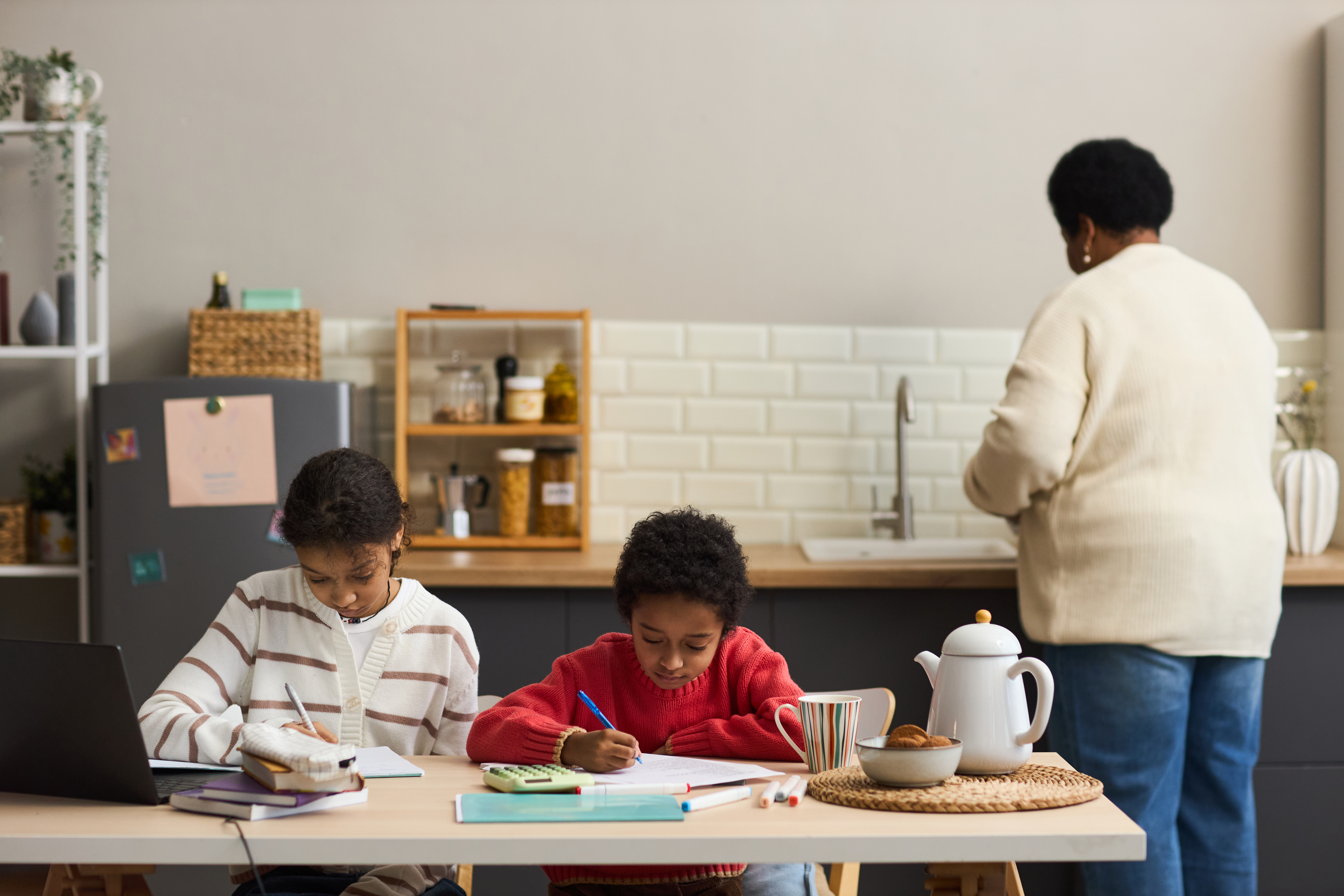 Black Woman Preparing Food While Two Children Stud 5dcfb08f2fc93110bd00