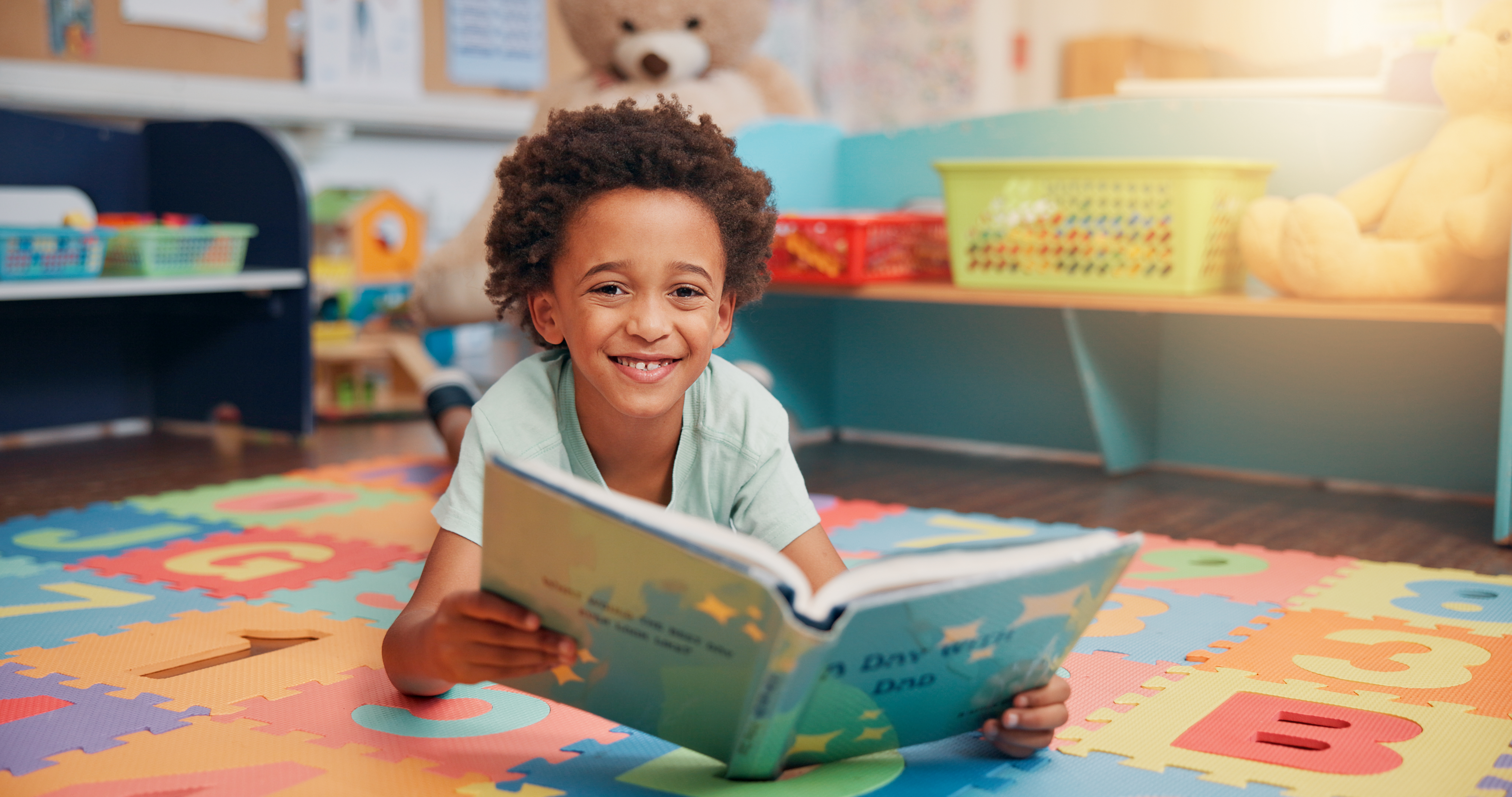 Boy Reading Book And Portrait On Floor In Home Fo 865b80a688d6c7721fea