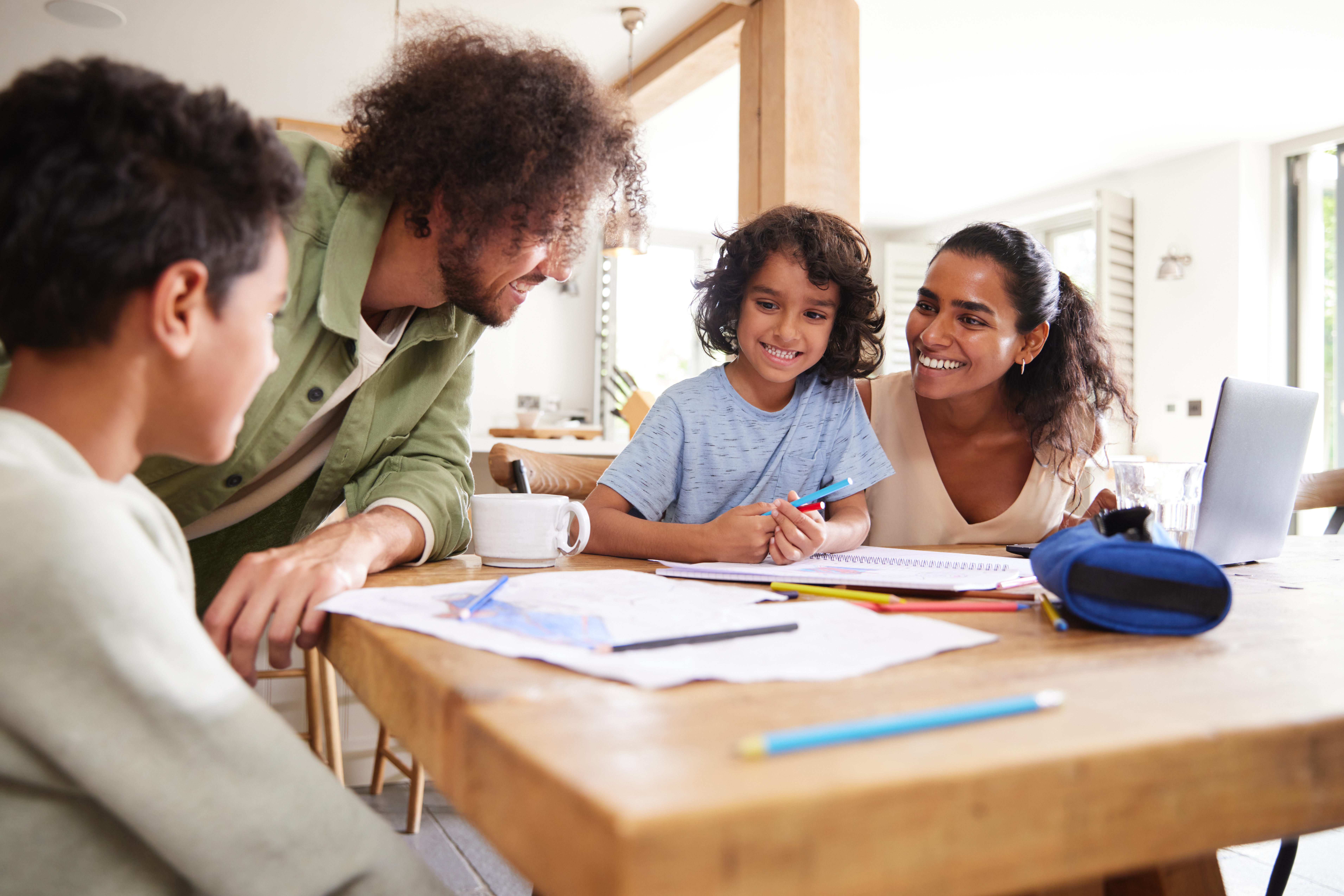 Boys Drawing At Kitchen Table With Parents 4b13d6cb92437eb209f9