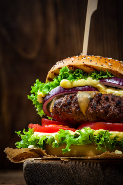 burger close up view on wooden background ec2b8f9e2af7206502b4