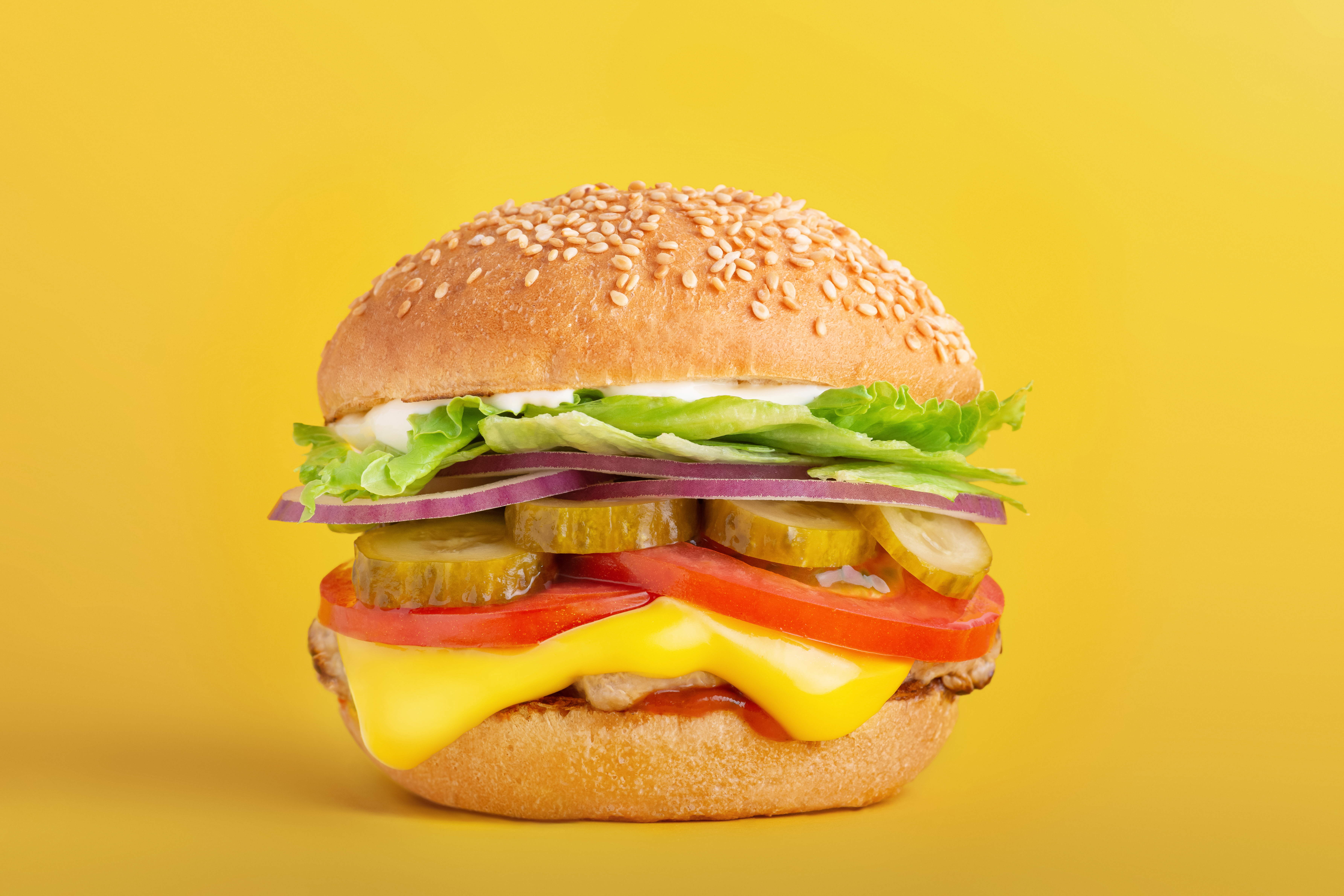 burger on a yellow bright background 8a36b4bf7966d941b6d5
