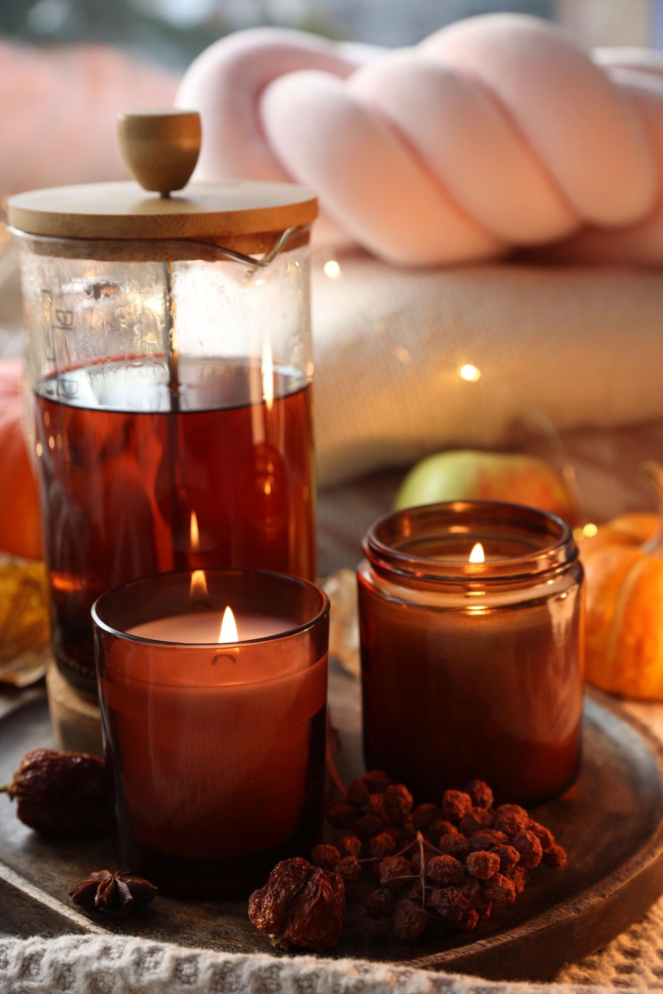 Aromatherapy candles and herbal tea creating a relaxing spa atmosphere