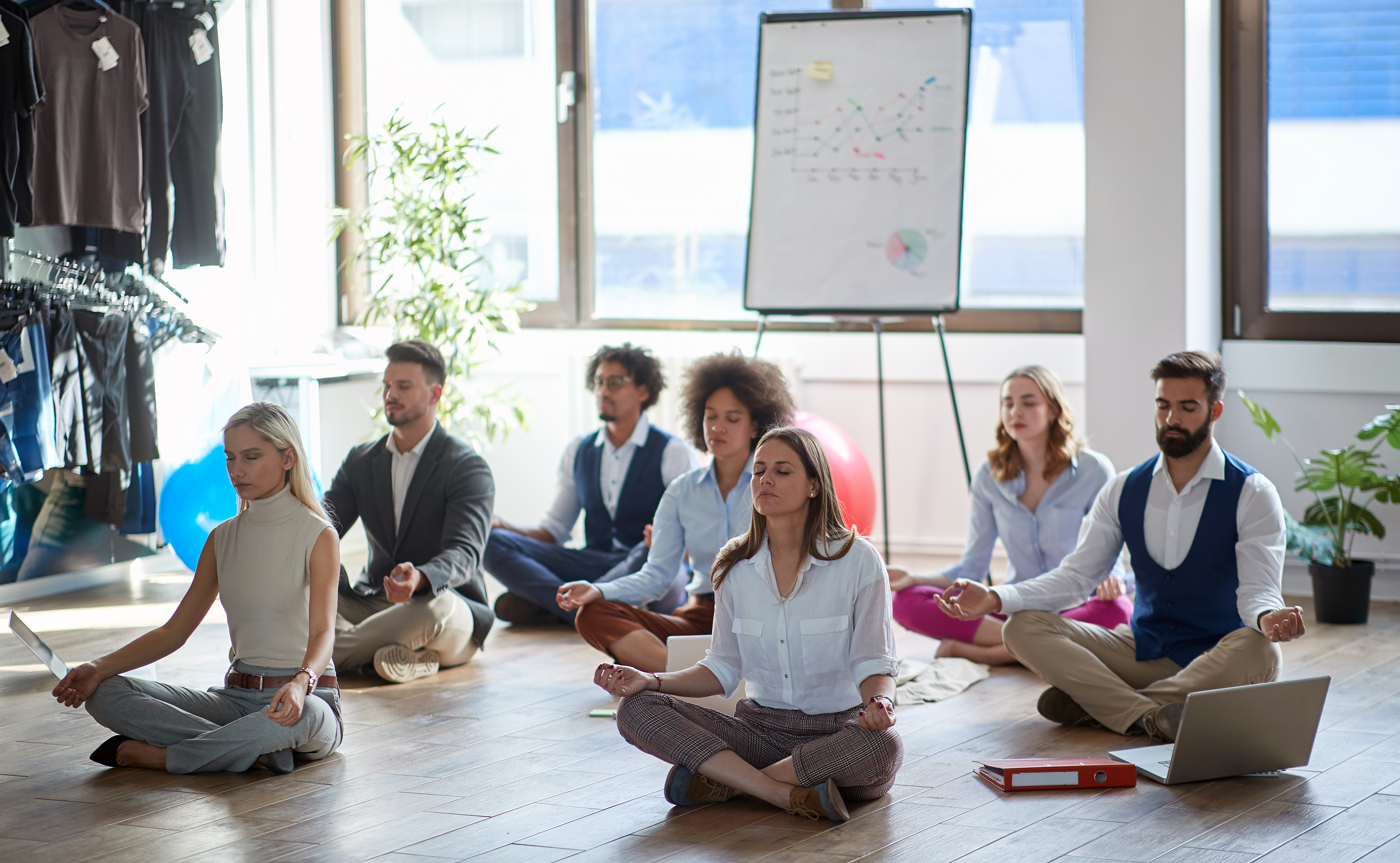 business colleagues meditating at work sitting on a5b370f56e4fe160f114
