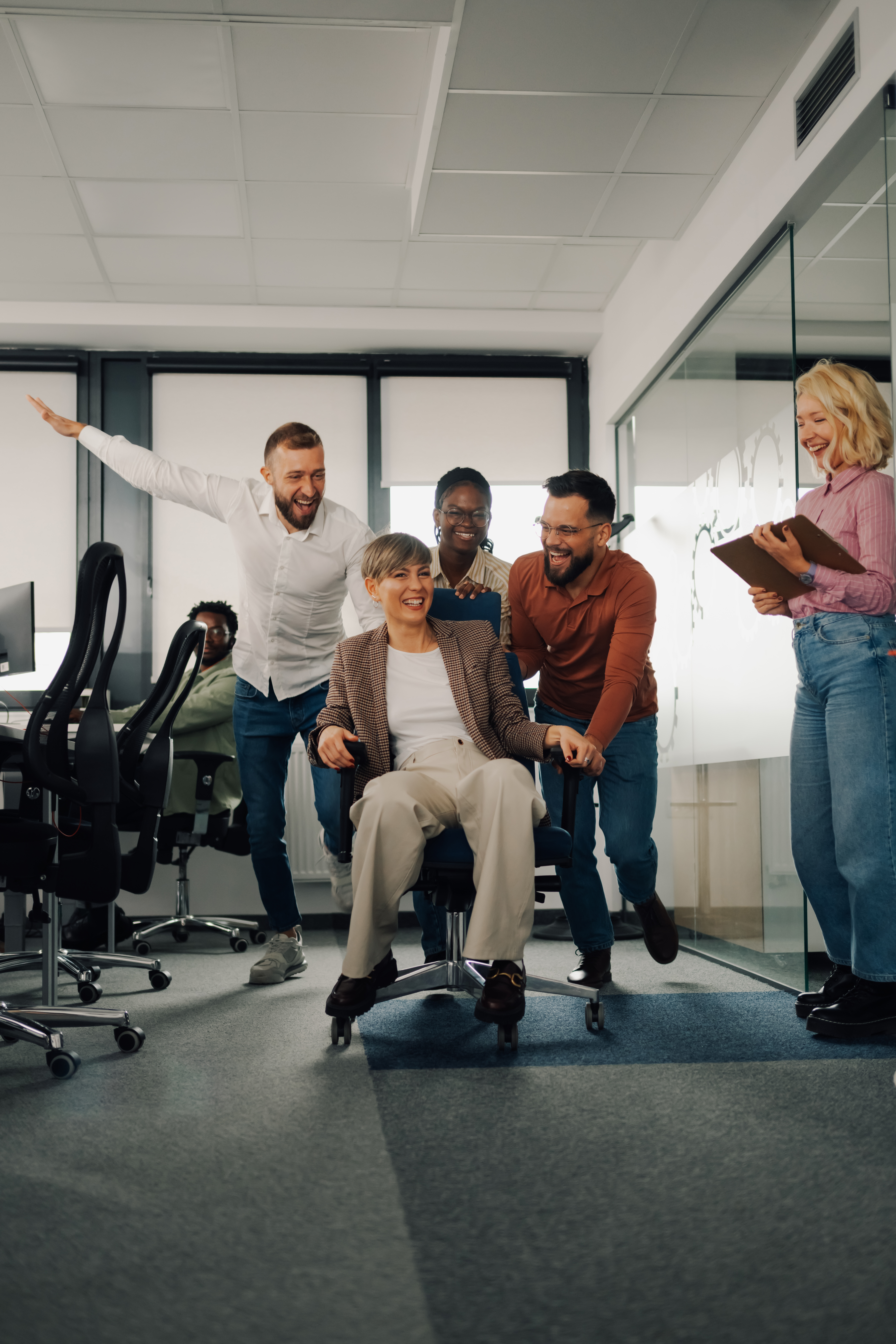 Unlock Your Hidden Strengths with Fun Skill-Building Exercises: Ready to Play and Grow? 5 business colleagues pushing mature businesswoman i c552b23129be3496a702