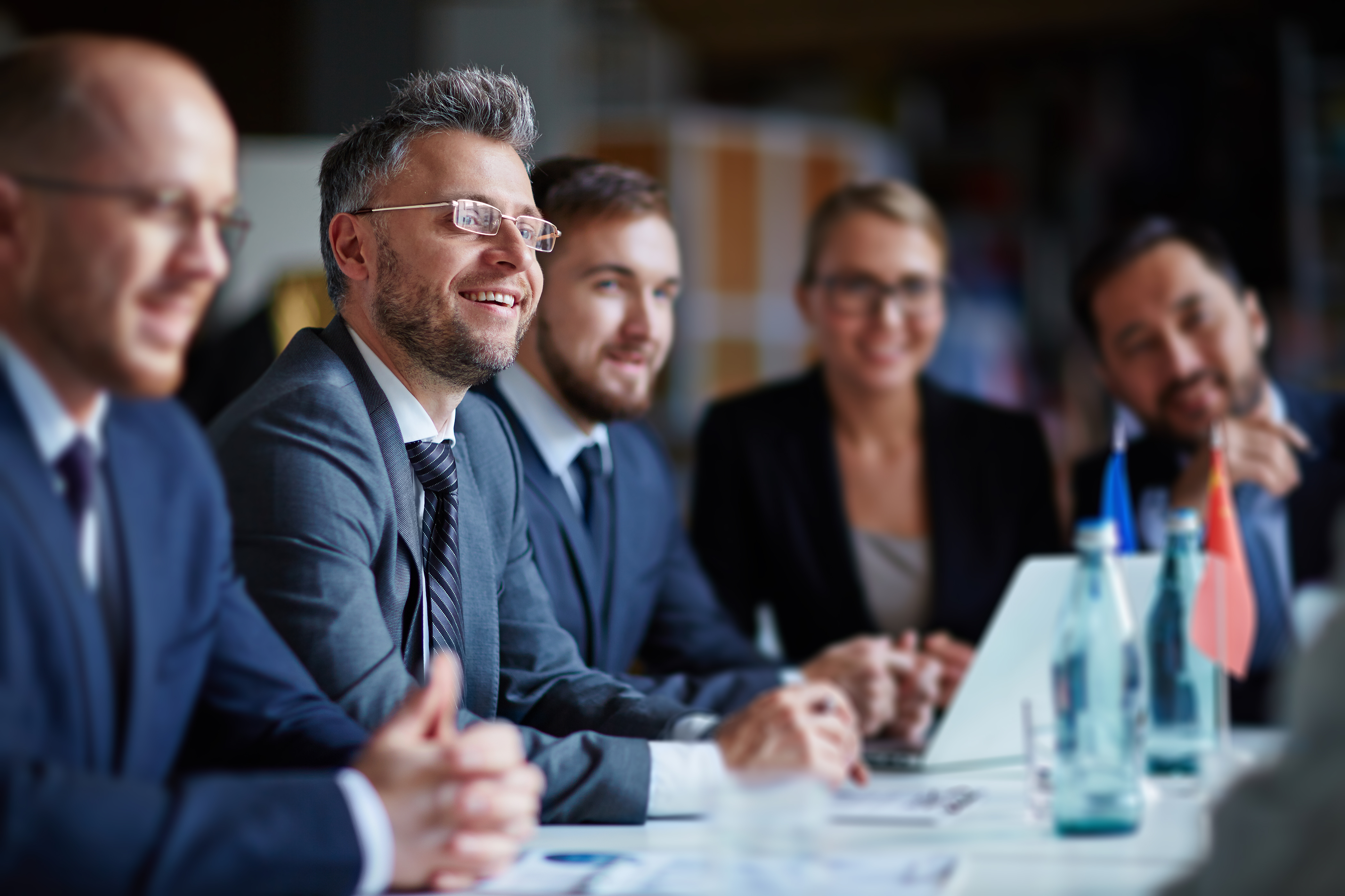 business group at conference b0a8f8340c838dacb422