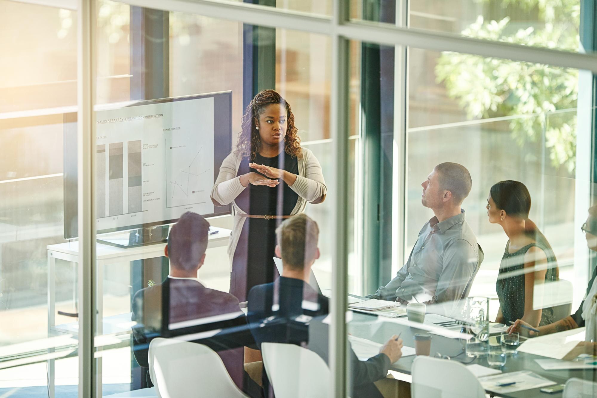 business people and tech in office for training br 707c39bbf94c69ae4897