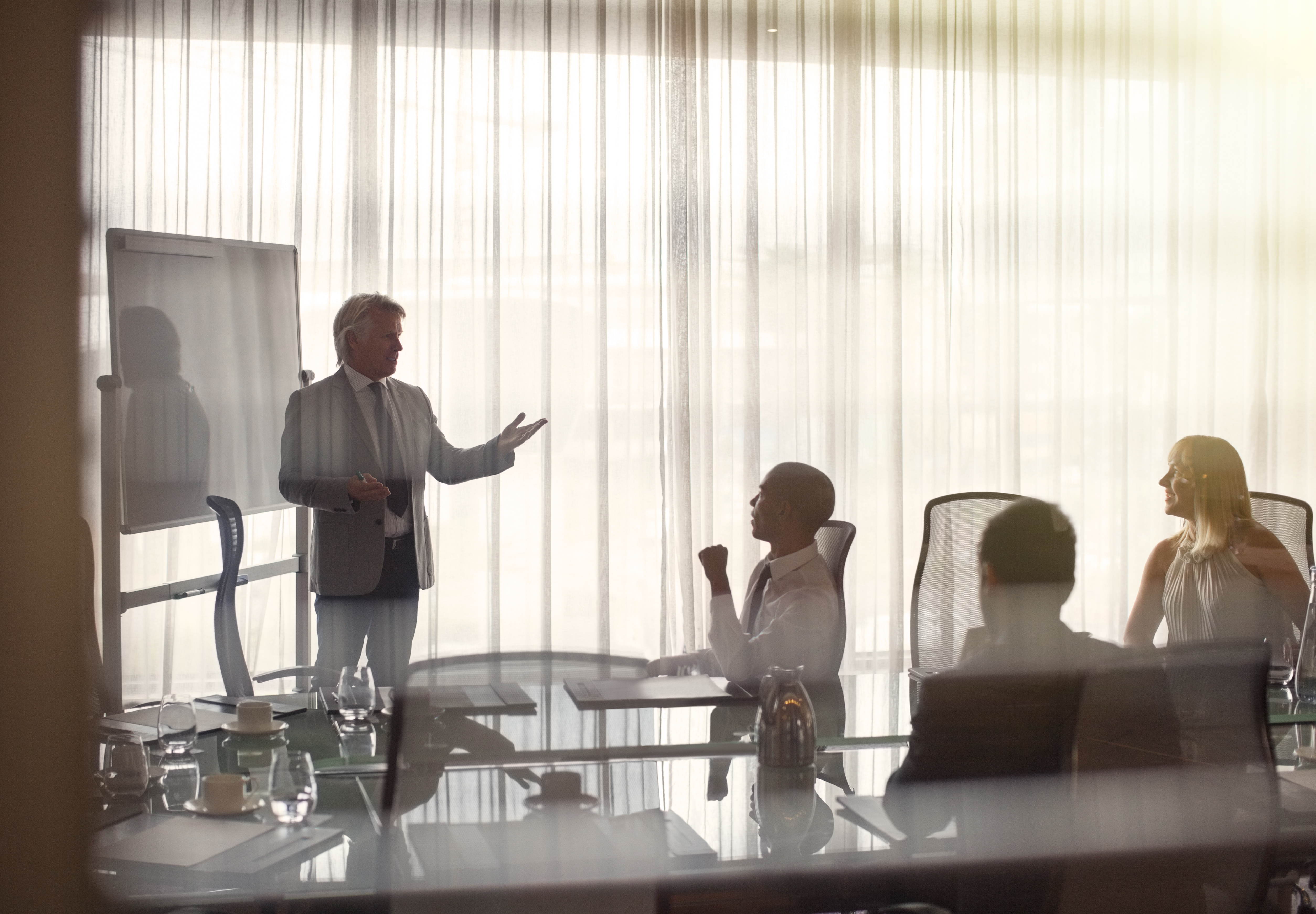 business people attending presentation in conferen 5ac8547c18362640f7dc