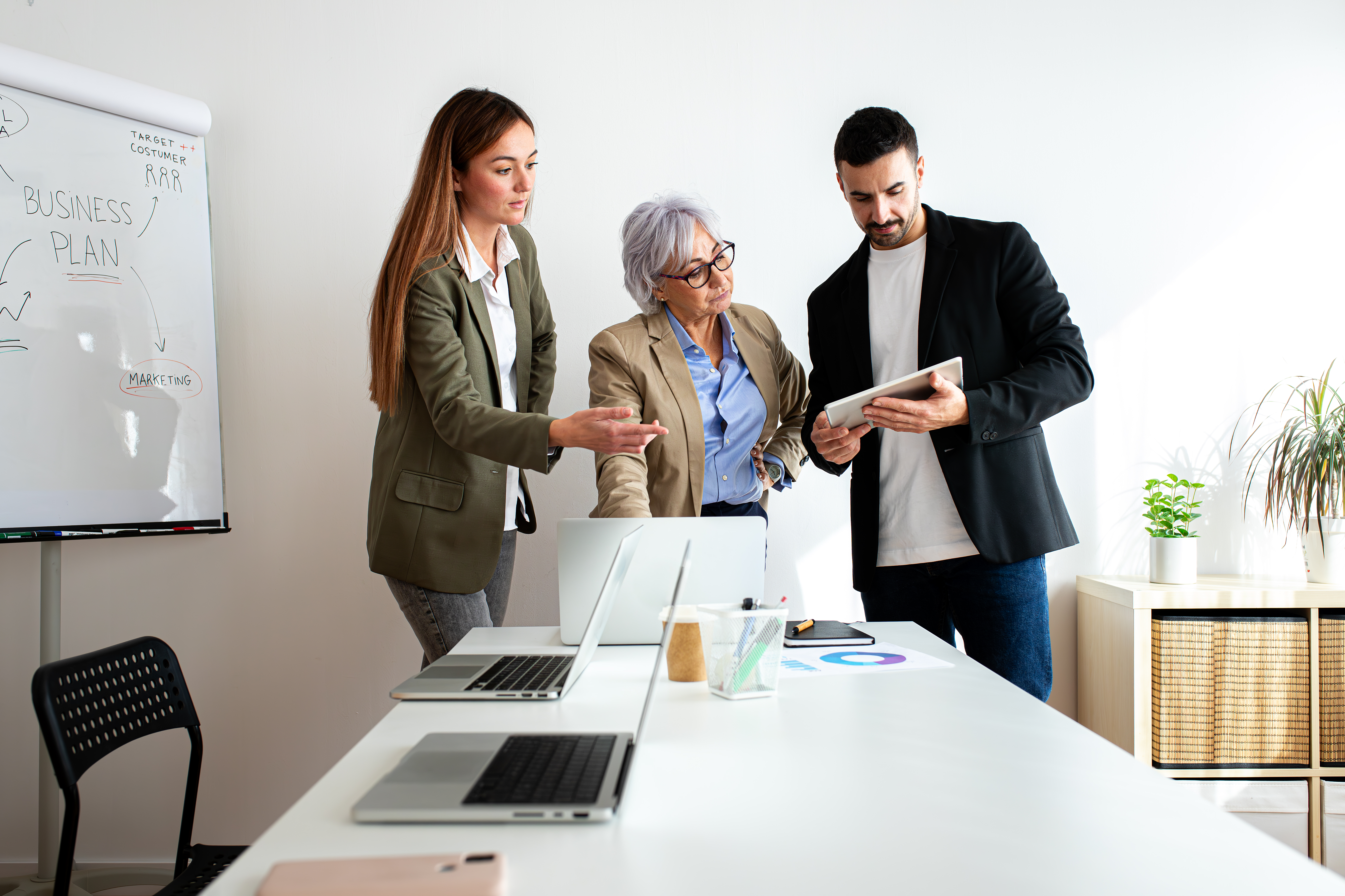 Collaborative Partnerships: Unlocking the Power of Digital Success 3 business team discussing marketing plan in the off 2d34b5eb25e8c291b9cb