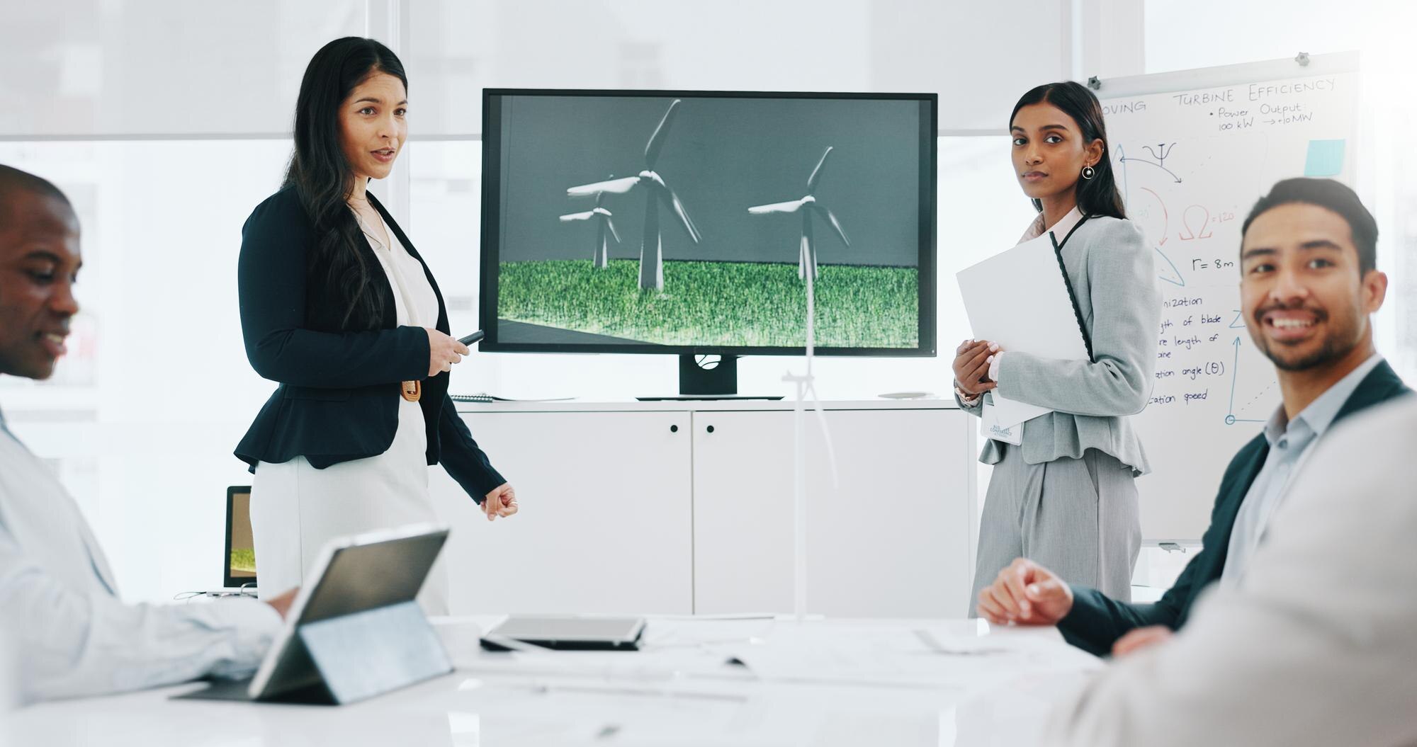 business woman presentation and wind turbine for e ae50d85c08d16c5ed706