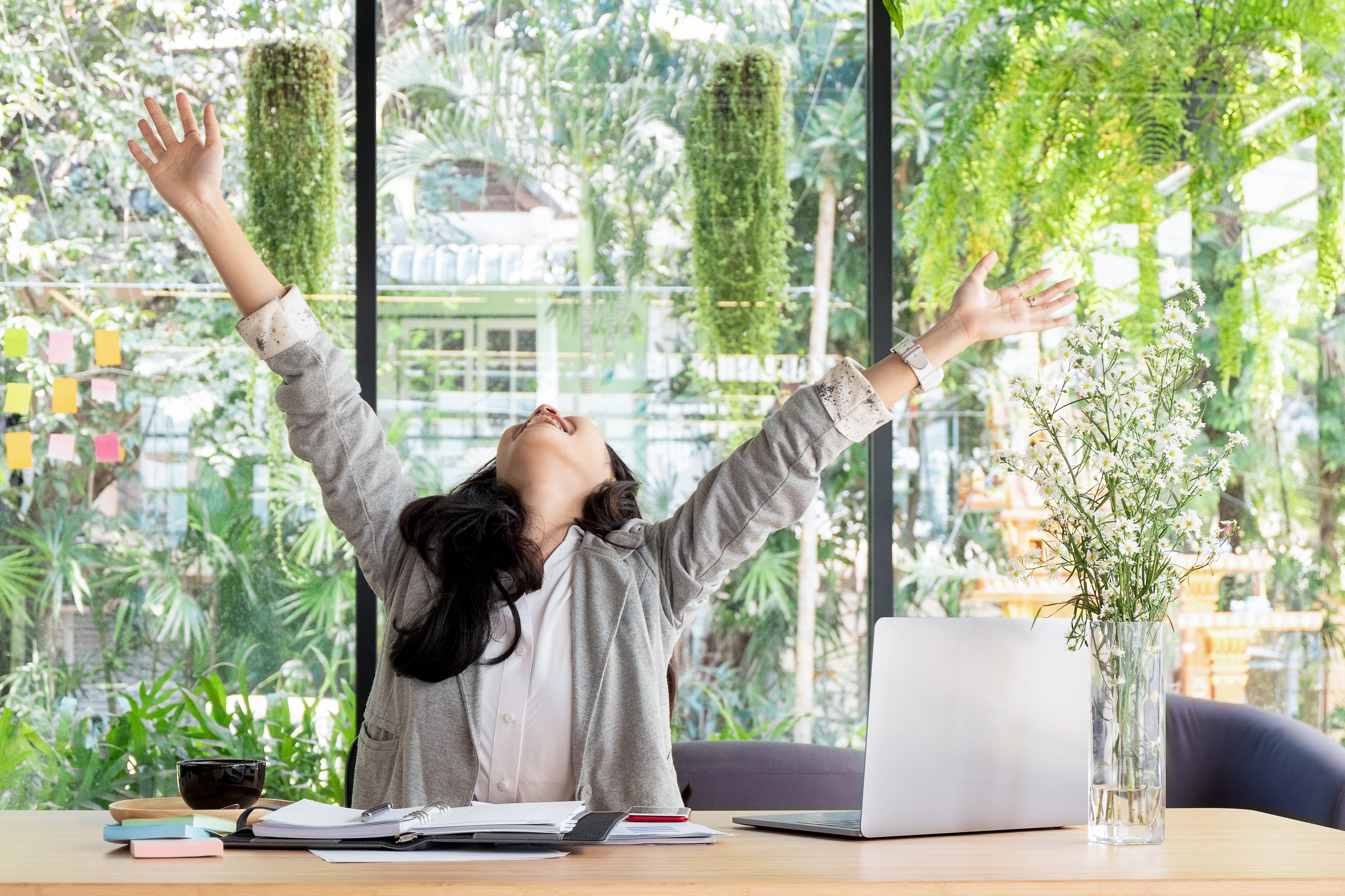 business woman smiling with arms up celebrating fo 6eaee84e7529110a1e8f